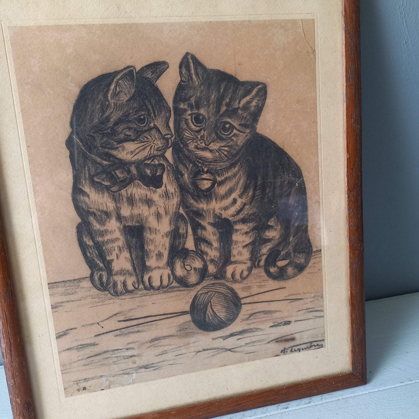 A French vintage drawing of two cute cats or kittens who look like they're planning to be naughty with their owner's ball of wool, a naive piece of art although none-the-less very charming indeed. It appears to be an original drawing, although I haven't opened up the back as it's well sealed with the original French framer's label. The drawing has been signed by the artist.