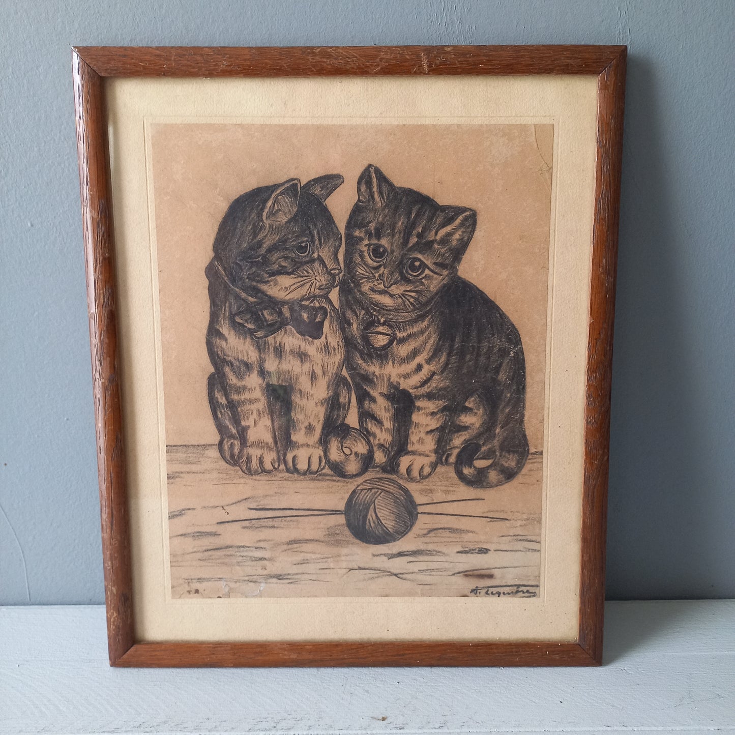 A French vintage drawing of two cute cats or kittens who look like they're planning to be naughty with their owner's ball of wool, a naive piece of art although none-the-less very charming indeed. It appears to be an original drawing, although I haven't opened up the back as it's well sealed with the original French framer's label. The drawing has been signed by the artist.