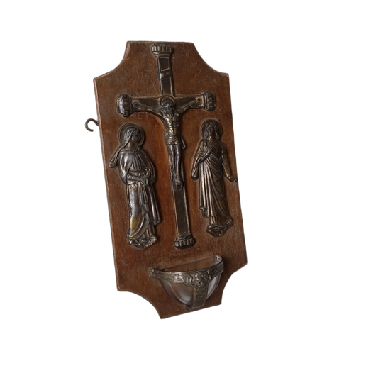 Wall-mounted vintage/antique religious wall decor with metal crucifix and religious figures, and a glass Holy Water font mounted to a wooden base. A great piece of original religious decor from France.