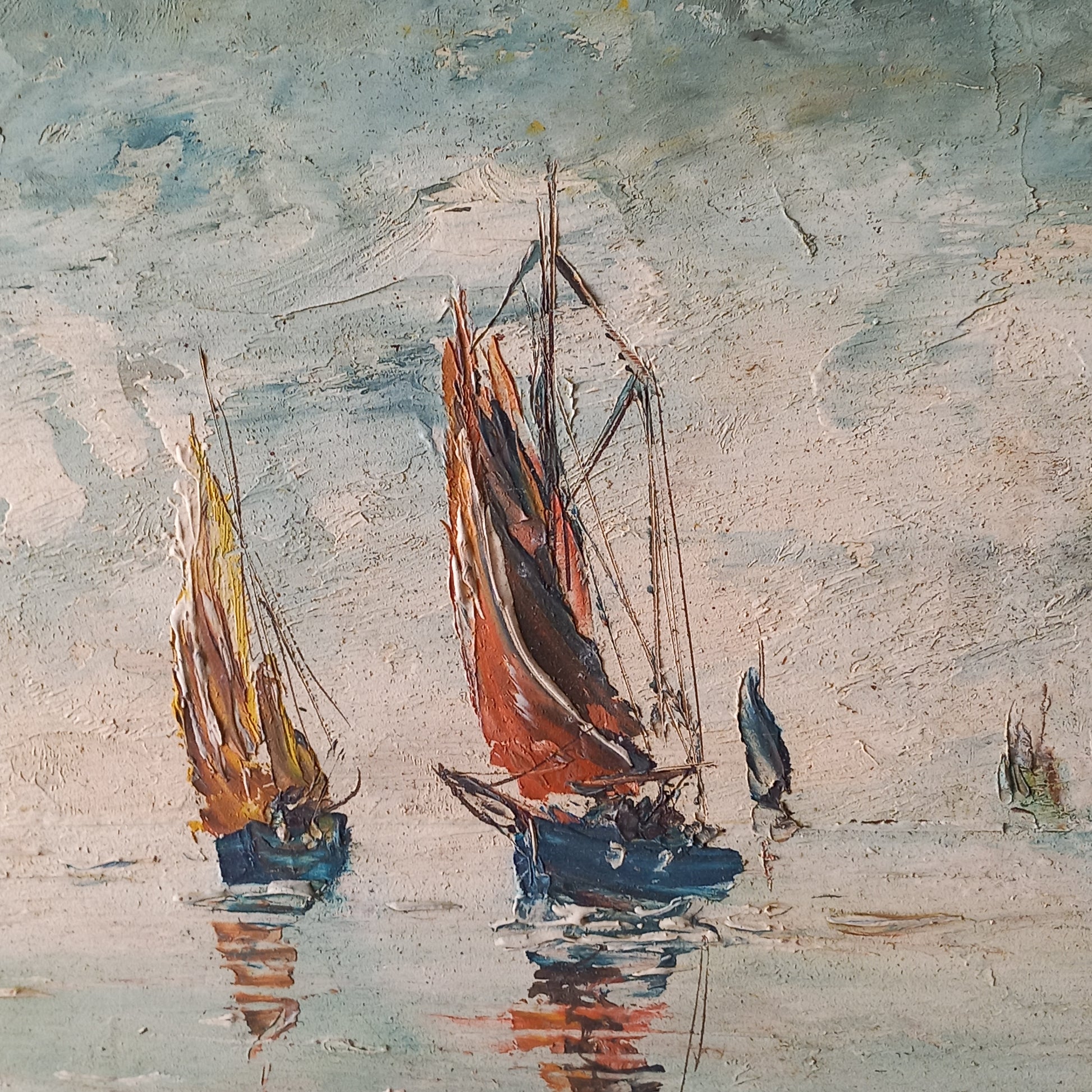 A beautiful piece of original French art depicting sailing boats on a rocky coastline. The painting is wonderfully done in a 'painterly' fashion with thick, vibrant oil paint strokes on hardboard. It has been signed and dated by the artist.