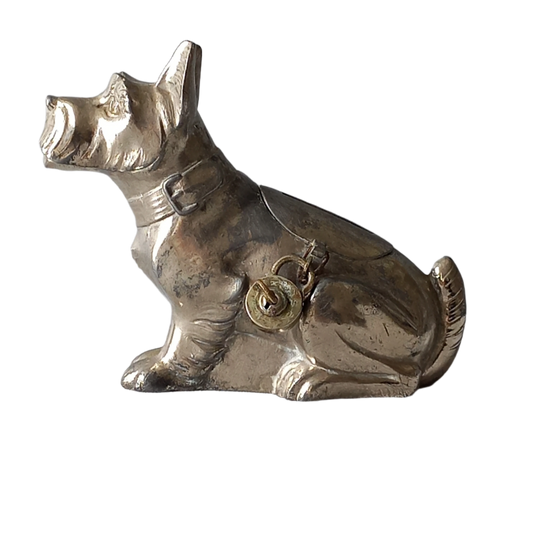 A fabulous French art deco metal terrier dog money box/coin storage box complete with a little padlock and key which still work. 
This unique piece of history was purchased in south west France and we can only imagine who once owned it and what they might have saved their coins to buy.