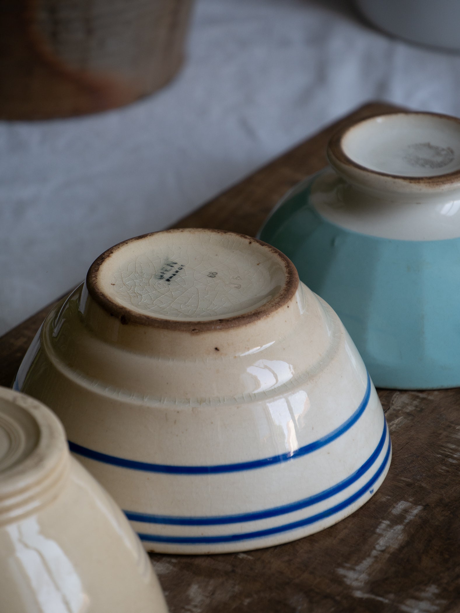 Three authentic French café-au-lait bowls in gently worn condition. Stack them for a slow weekend breakfast display, line them on an open shelf, or fill each with seasonal fruit for an easy pop of colour.