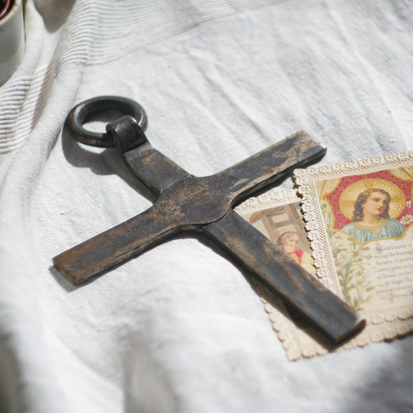 An interesting French antique artisan made Crucifix made from iron and painted black. On one side the metal has worn away in places giving this piece a pleasing patina of age. There's a hanging loop so it's ready to hang in your home.
We guesstimate this piece to be over 100 years old.