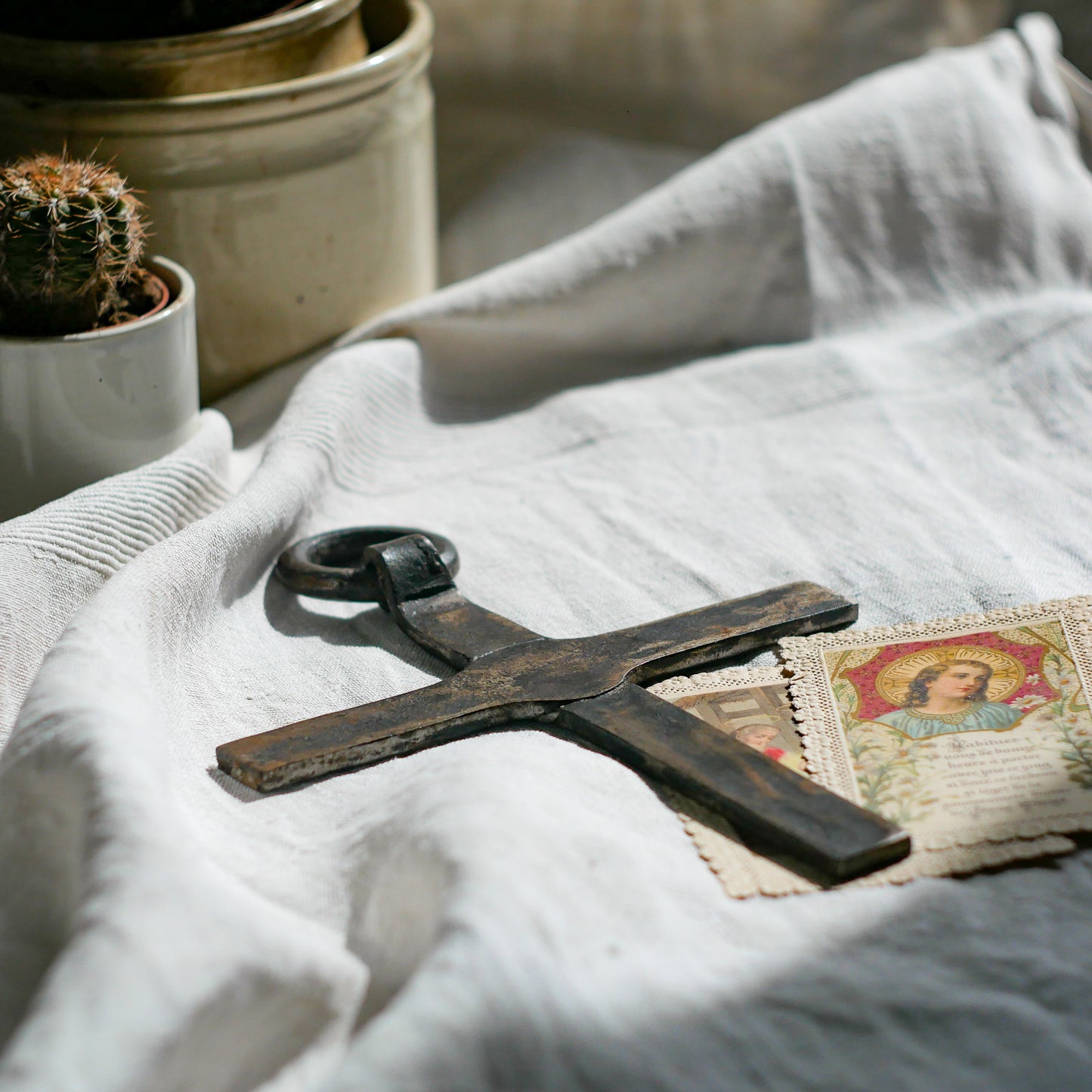 An interesting French antique artisan made Crucifix made from iron and painted black. On one side the metal has worn away in places giving this piece a pleasing patina of age. There's a hanging loop so it's ready to hang in your home.
We guesstimate this piece to be over 100 years old.