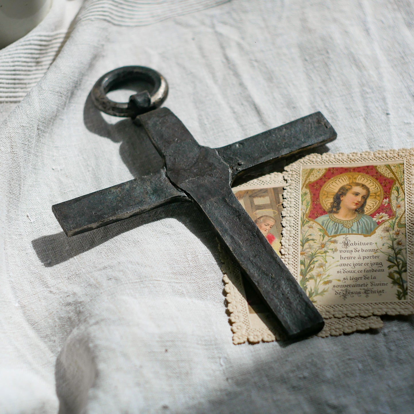 An interesting French antique artisan made Crucifix made from iron and painted black. On one side the metal has worn away in places giving this piece a pleasing patina of age. There's a hanging loop so it's ready to hang in your home.
We guesstimate this piece to be over 100 years old.