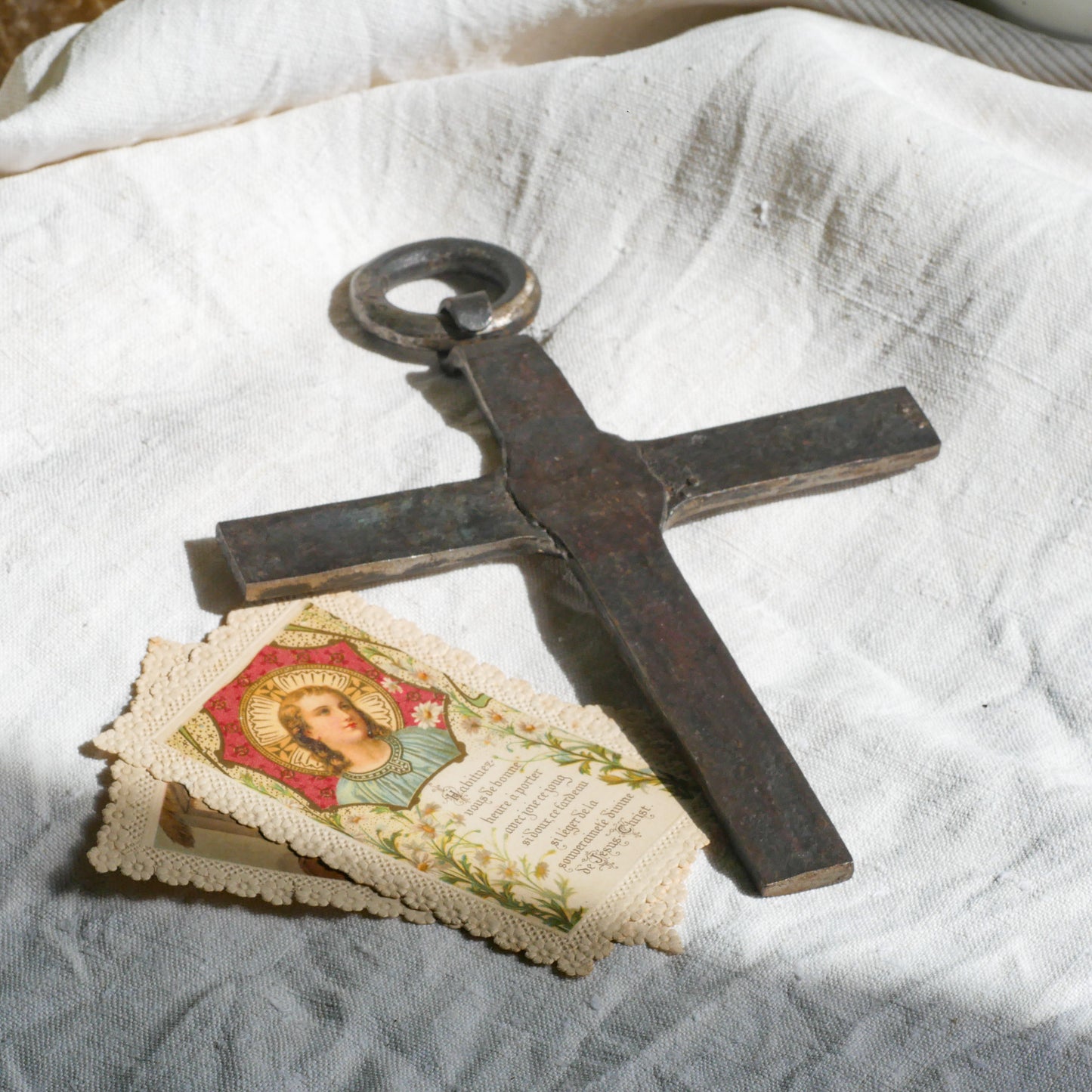 An interesting French antique artisan made Crucifix made from iron and painted black. On one side the metal has worn away in places giving this piece a pleasing patina of age. There's a hanging loop so it's ready to hang in your home.
We guesstimate this piece to be over 100 years old.