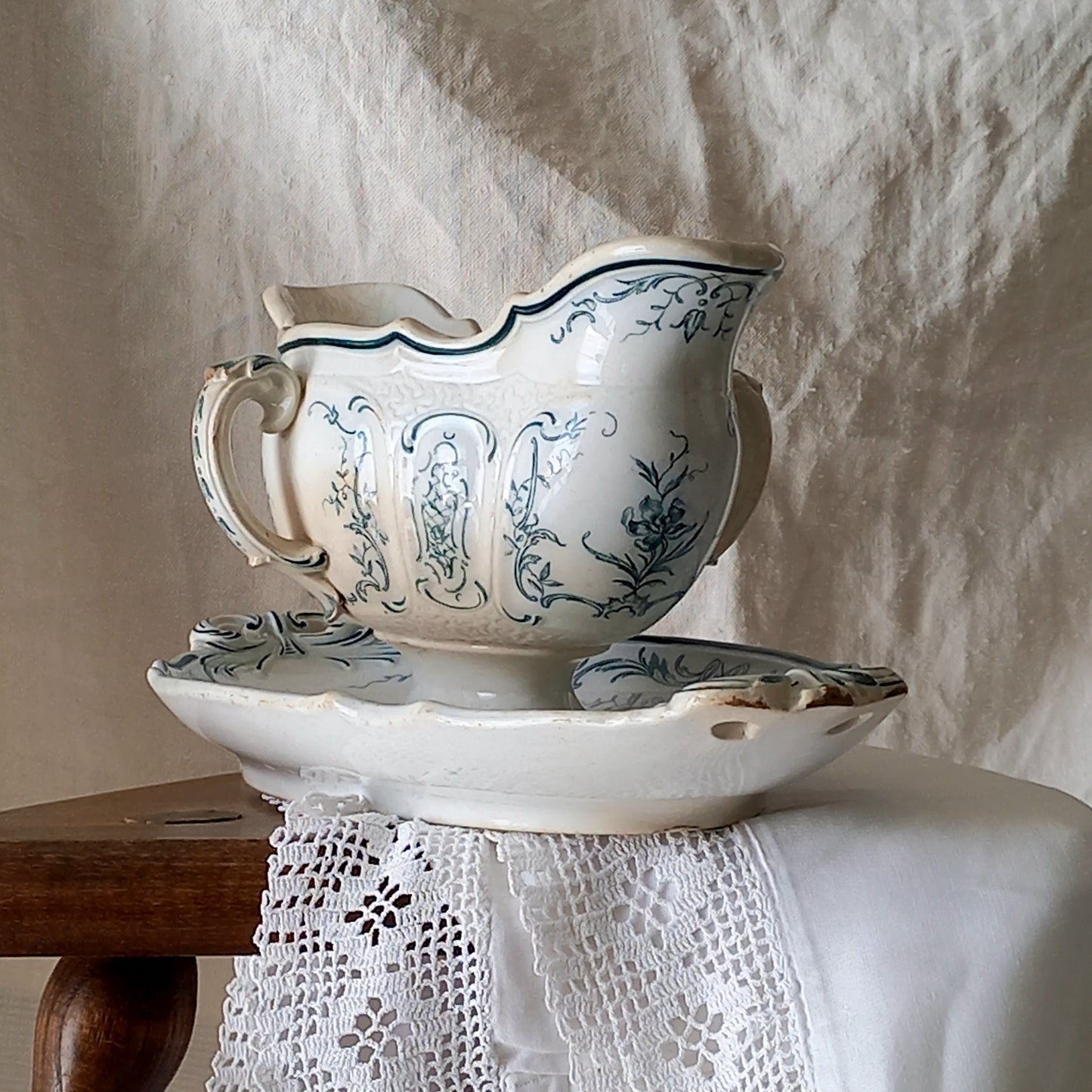 A large and elegant antique ironstone sauce boat with a green floral transferware pattern, a grand-looking, heavy piece. These days this piece will make an excellent piece of decor in any home, especially those of a country or farmhouse nature.