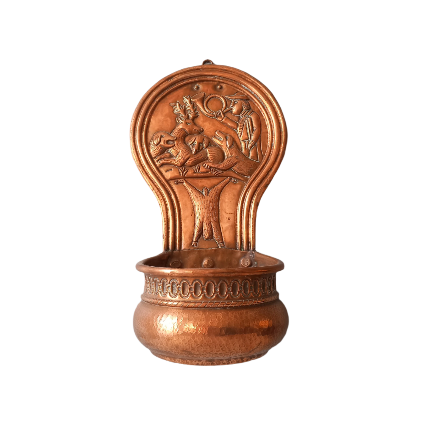 A very handsome copper vintage/antique wall-mounted planter with a hunting scene that I purchased in south west France.
This wonderful rustic piece may at some time have had another purpose, although being a planter seems to suit it just perfectly. There is a hanging hook to the rear, although it can also be displayed sitting on a flat surface as it's depicted in my photos - it's very interesting that we can also see the crude yet charming way this heavy copper planter was constructed by the artisan.