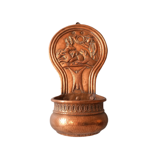 A very handsome copper vintage/antique wall-mounted planter with a hunting scene that I purchased in south west France.
This wonderful rustic piece may at some time have had another purpose, although being a planter seems to suit it just perfectly. There is a hanging hook to the rear, although it can also be displayed sitting on a flat surface as it's depicted in my photos - it's very interesting that we can also see the crude yet charming way this heavy copper planter was constructed by the artisan.