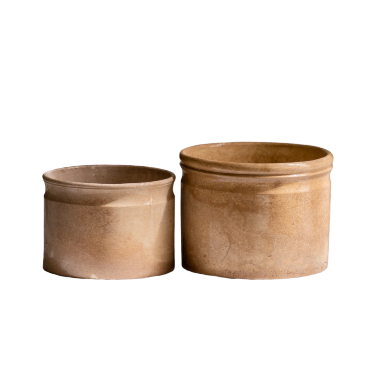 A pair of French antique tea-stained white to creamy brown ironstone crock pots or preserve pots.
In the past these small pots were quintessential pieces in French kitchens for storing jam, etc, and these days are still just as useful for items such as utensils.
Smaller pot was manufactured by Choisy le Roi, circa. late 1800s. The larger pot has no maker's mark - circa. late 1800s/early 1900s.