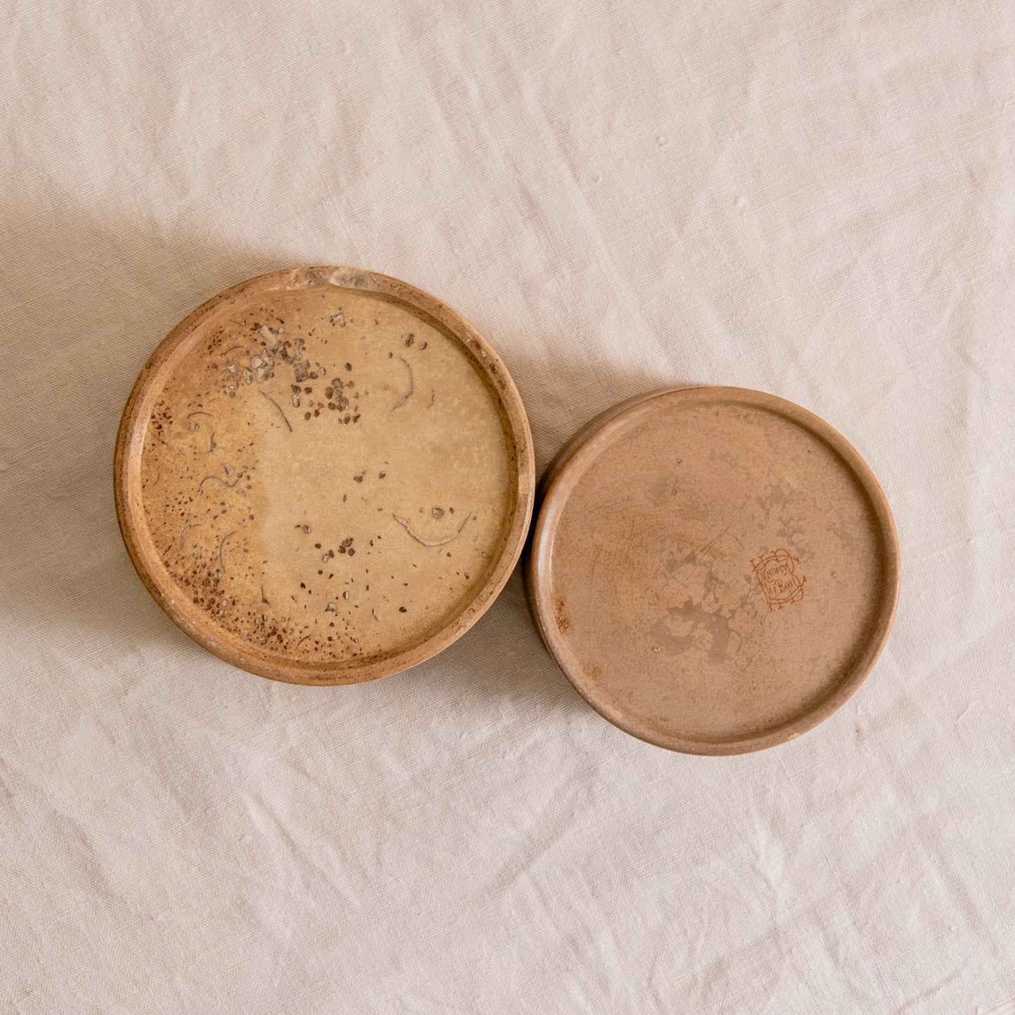 A pair of French antique tea-stained white to creamy brown ironstone crock pots or preserve pots.
In the past these small pots were quintessential pieces in French kitchens for storing jam, etc, and these days are still just as useful for items such as utensils.
Smaller pot was manufactured by Choisy le Roi, circa. late 1800s. The larger pot has no maker's mark - circa. late 1800s/early 1900s.