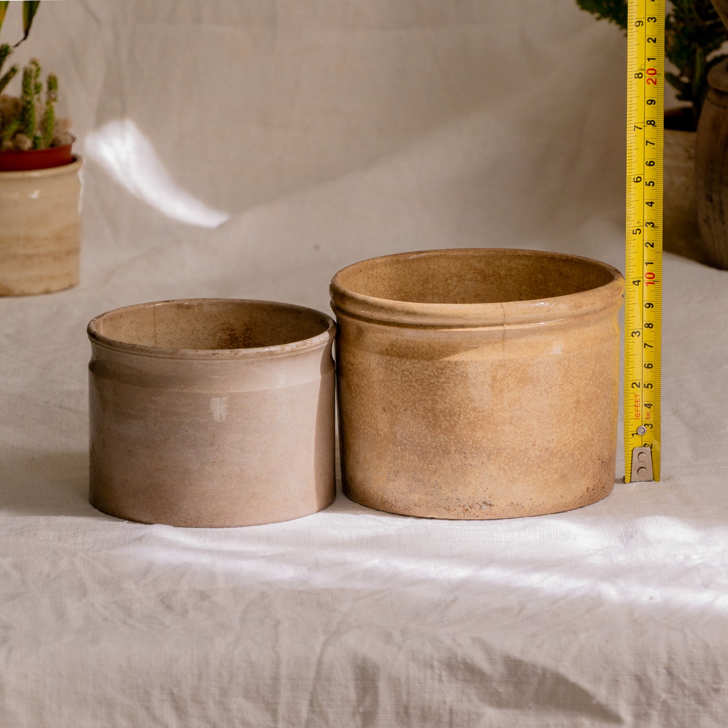 A pair of French antique tea-stained white to creamy brown ironstone crock pots or preserve pots.
In the past these small pots were quintessential pieces in French kitchens for storing jam, etc, and these days are still just as useful for items such as utensils.
Smaller pot was manufactured by Choisy le Roi, circa. late 1800s. The larger pot has no maker's mark - circa. late 1800s/early 1900s.