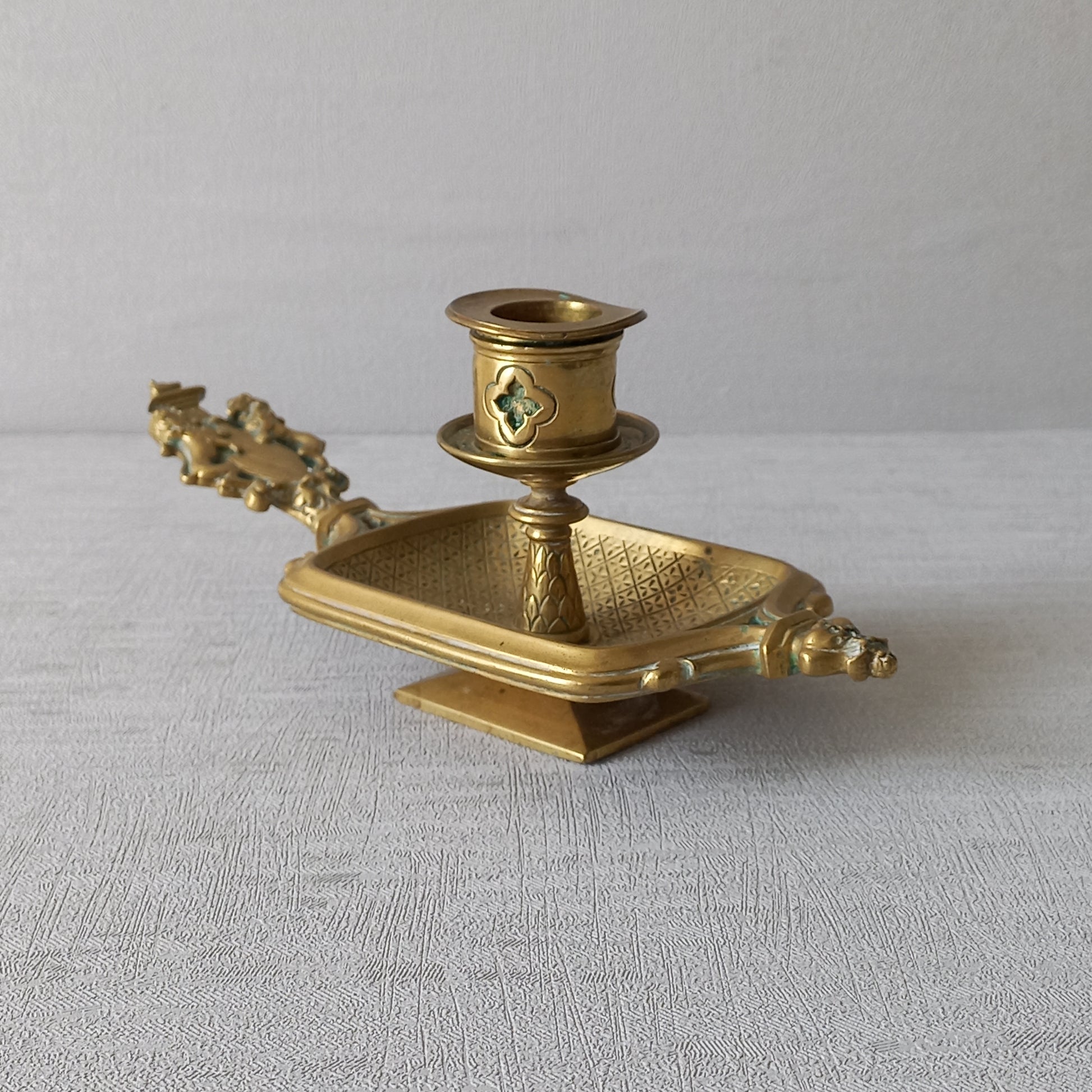 A French antique bronze/brass candle holder or chamber stick, a quality piece that is highly detailed with engraved patterns and a coat of arms with two lovely lions on the handle! This is a heavy piece for its small size and will make super home decor in any interior.