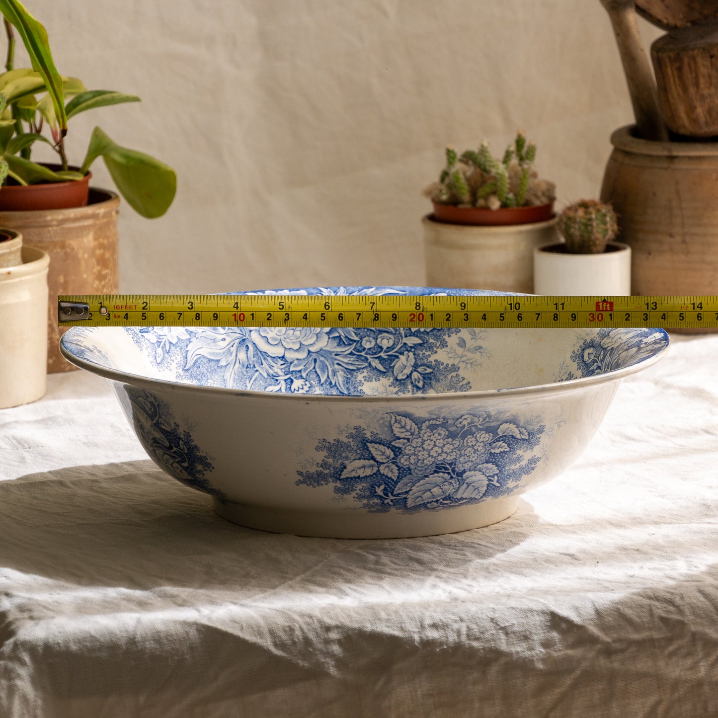 A large and beautiful antique white ironstone bowl or wash basin with blue floral pattern by premier French manufacturer, Sarreguemines.
This piece is circa. 1875 - 1900 so well over 100 years old! 
A stunning piece of original antique ironstone from France that will make excellent home decor.