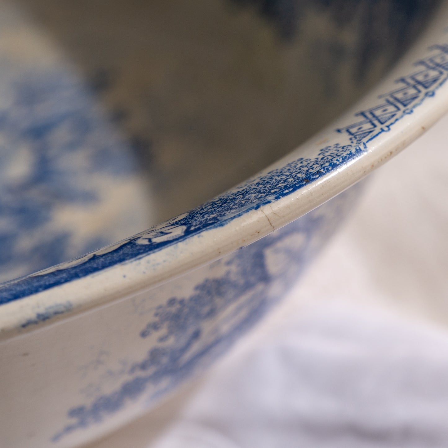 A large and beautiful antique white ironstone bowl or wash basin with blue floral pattern by premier French manufacturer, Sarreguemines.
This piece is circa. 1875 - 1900 so well over 100 years old! 
A stunning piece of original antique ironstone from France that will make excellent home decor.