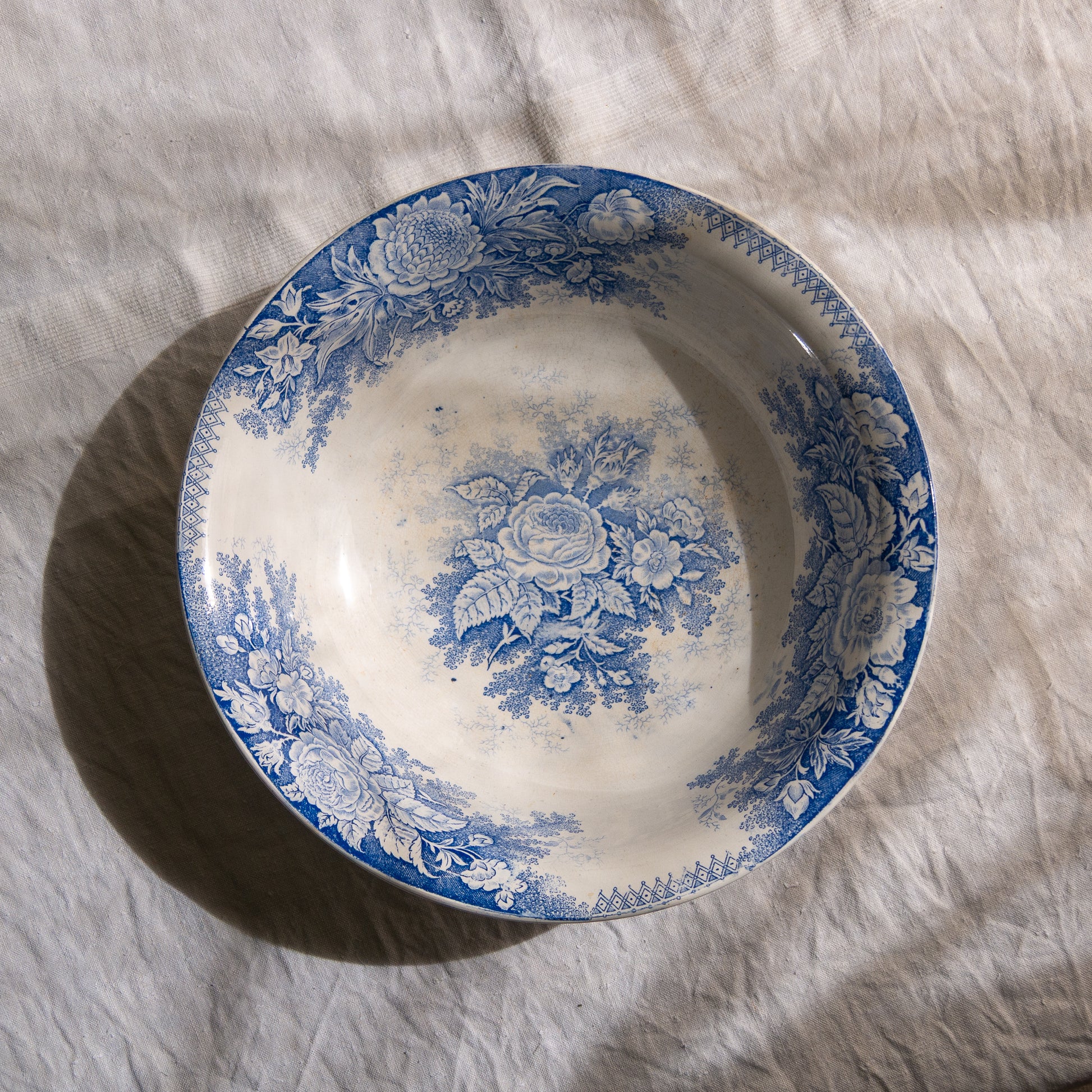 A large and beautiful antique white ironstone bowl or wash basin with blue floral pattern by premier French manufacturer, Sarreguemines.
This piece is circa. 1875 - 1900 so well over 100 years old! 
A stunning piece of original antique ironstone from France that will make excellent home decor.