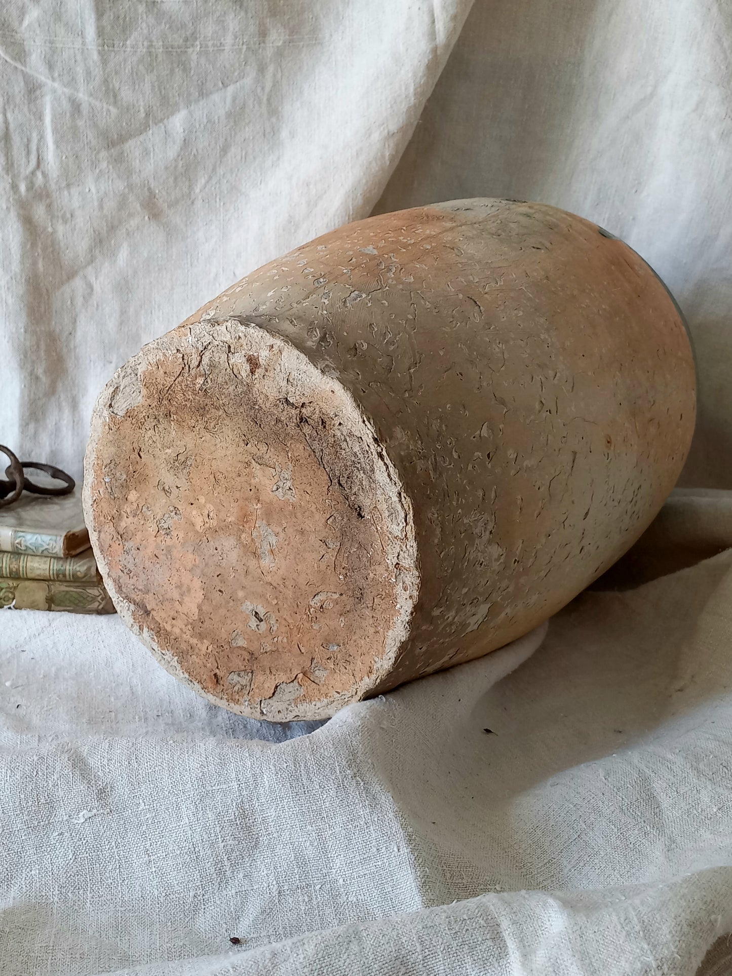 A rare and very large French antique stoneware preserving jar in a lovely shade of green over an earthy beige.