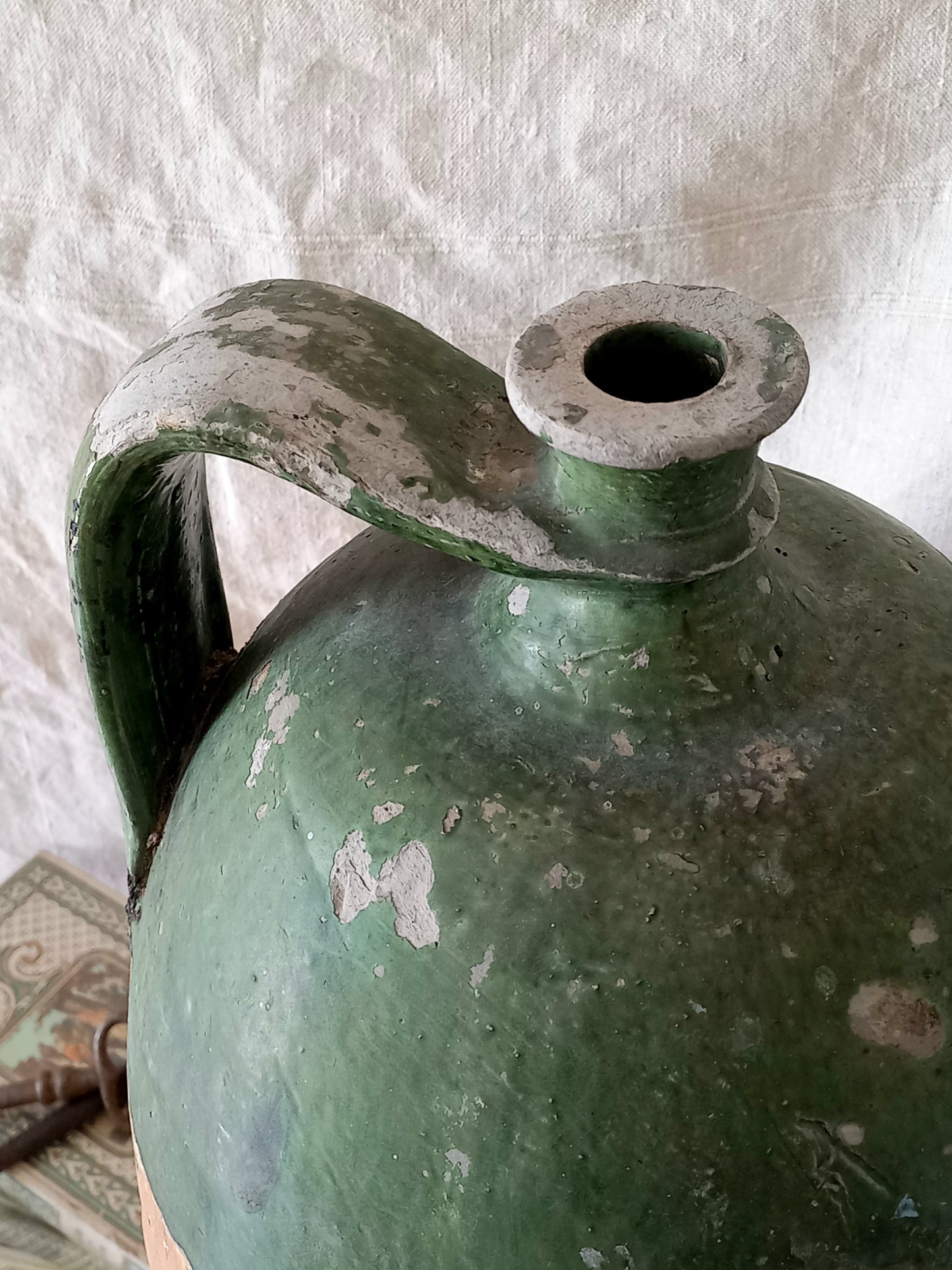 A rare and very large French antique stoneware preserving jar in a lovely shade of green over an earthy beige.