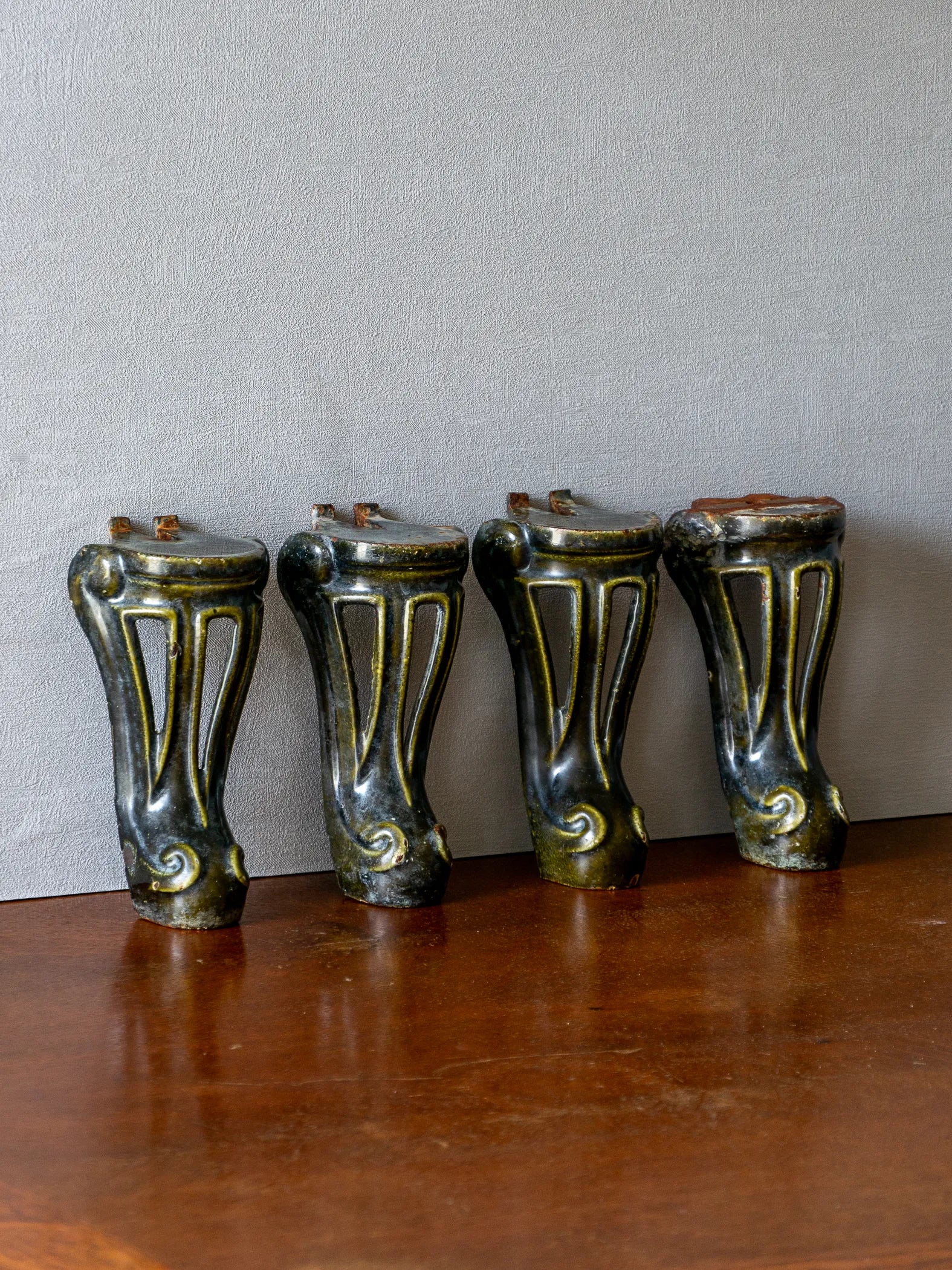 A set of 4 French vintage/antique cast iron bath feet / furniture feet with green enamel finishes, beautifully detailed and decorative pieces perfect for finishing a furniture project.