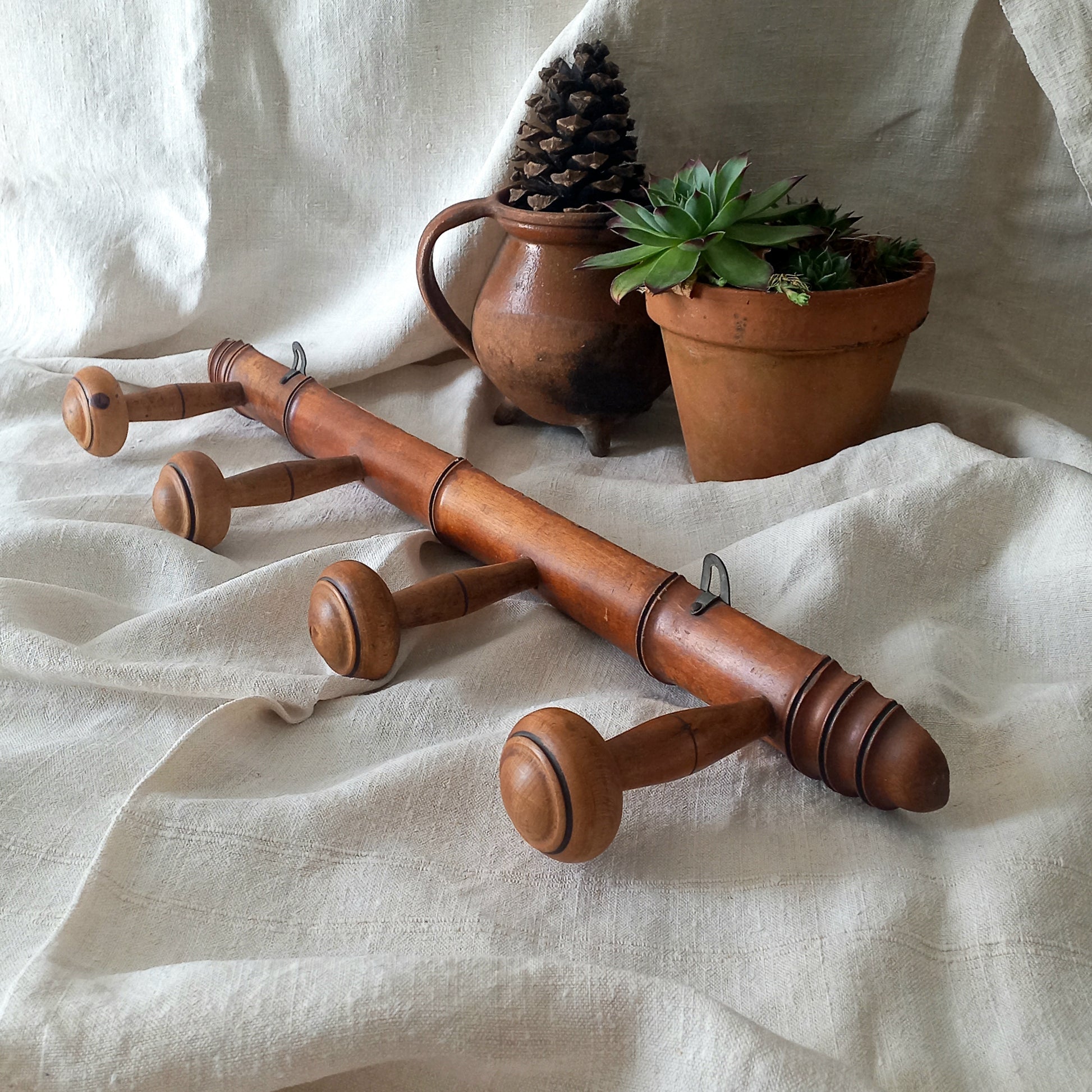 A French vintage faux bamboo wooden coat rack with 4 hanging hooks/pegs. These older type of faux bamboo coat racks are becoming increasingly difficult to source, especially in this excellent condition! There are two metal hanging hooks to the rear for mounting to your wall.
In summary, a wonderful piece of wall decor for any interior, and especially those of a country home, rustic or farmhouse style.