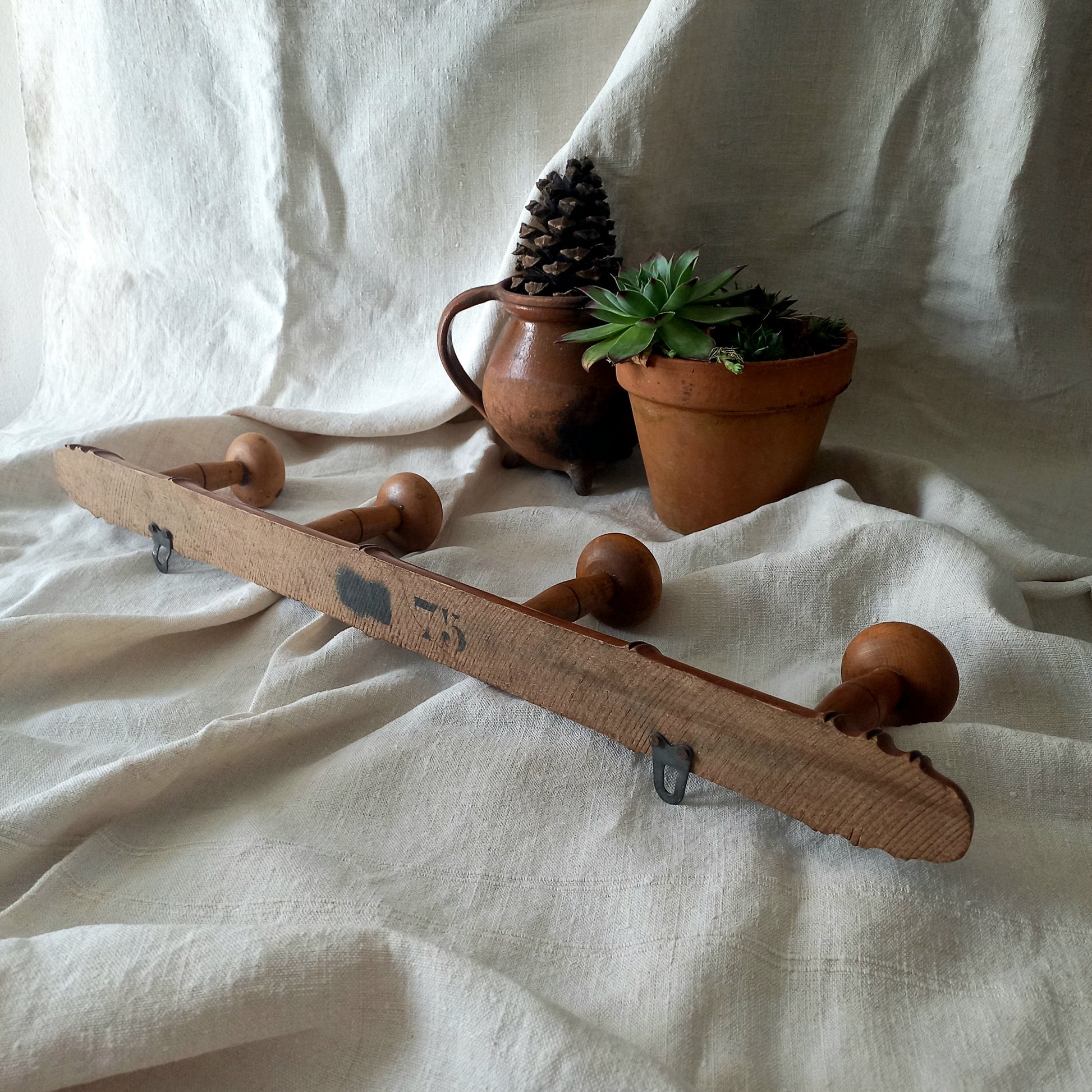 A French vintage faux bamboo wooden coat rack with 4 hanging hooks/pegs. These older type of faux bamboo coat racks are becoming increasingly difficult to source, especially in this excellent condition! There are two metal hanging hooks to the rear for mounting to your wall.
In summary, a wonderful piece of wall decor for any interior, and especially those of a country home, rustic or farmhouse style.
