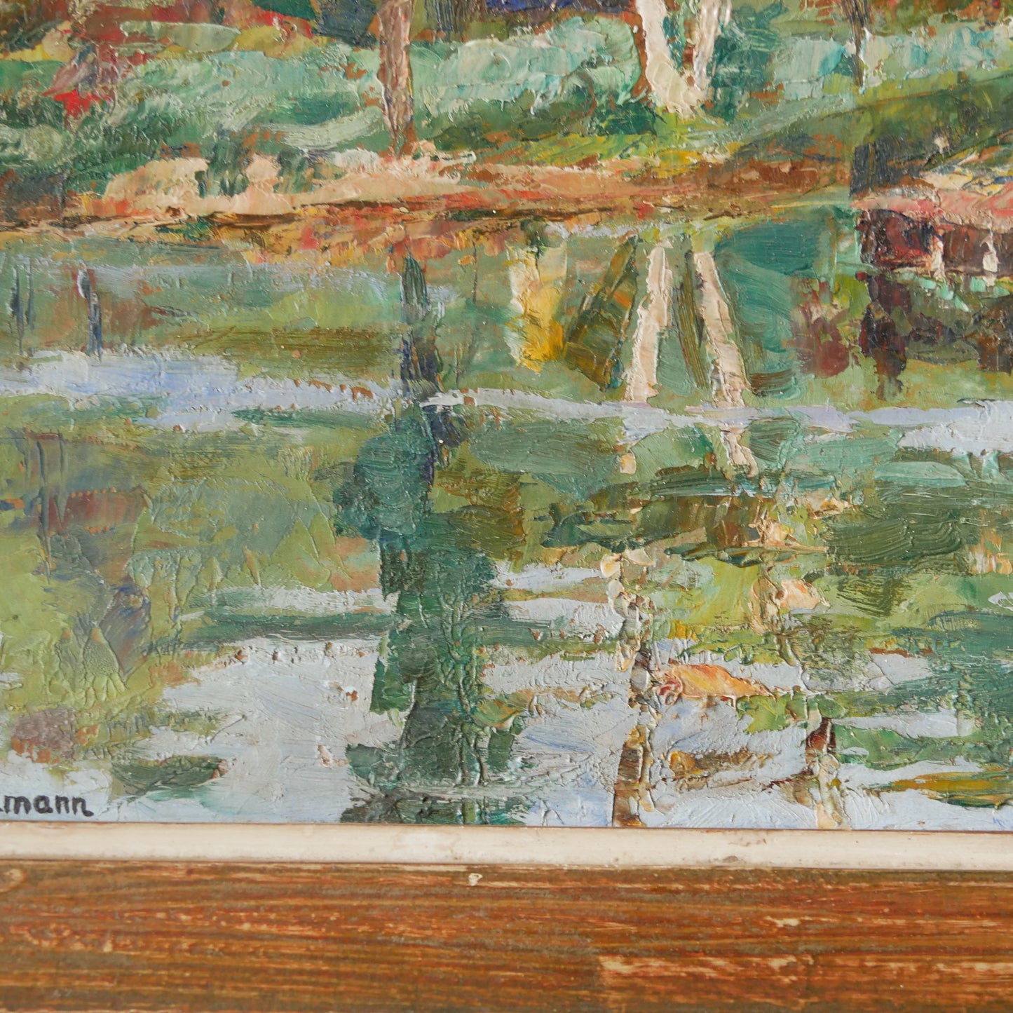 An original vintage landscape oil painting depicting a charming country home in among a wooded area with hills in the background. In the foreground a gentle river reflects the trees in the background.
The painting has been painted by an experienced artist with confident brush strokes - a really wonderful piece of original art.
The painting is presented in an old worn wooden frame which we love and think others will too - it really suits this piece.