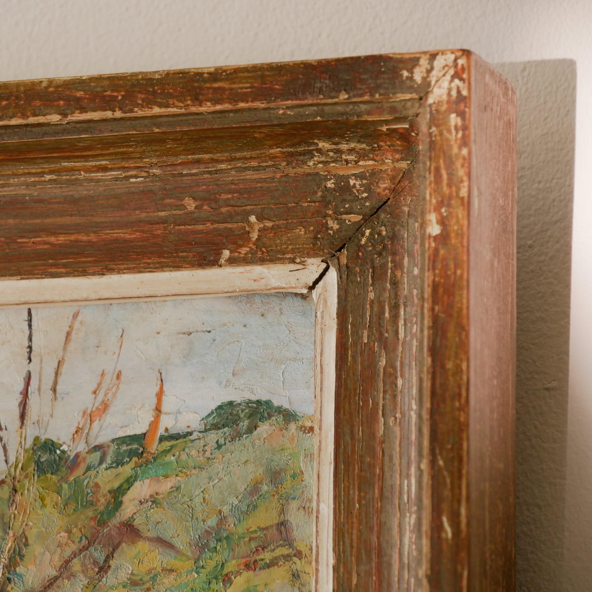 An original vintage landscape oil painting depicting a charming country home in among a wooded area with hills in the background. In the foreground a gentle river reflects the trees in the background.
The painting has been painted by an experienced artist with confident brush strokes - a really wonderful piece of original art.
The painting is presented in an old worn wooden frame which we love and think others will too - it really suits this piece.