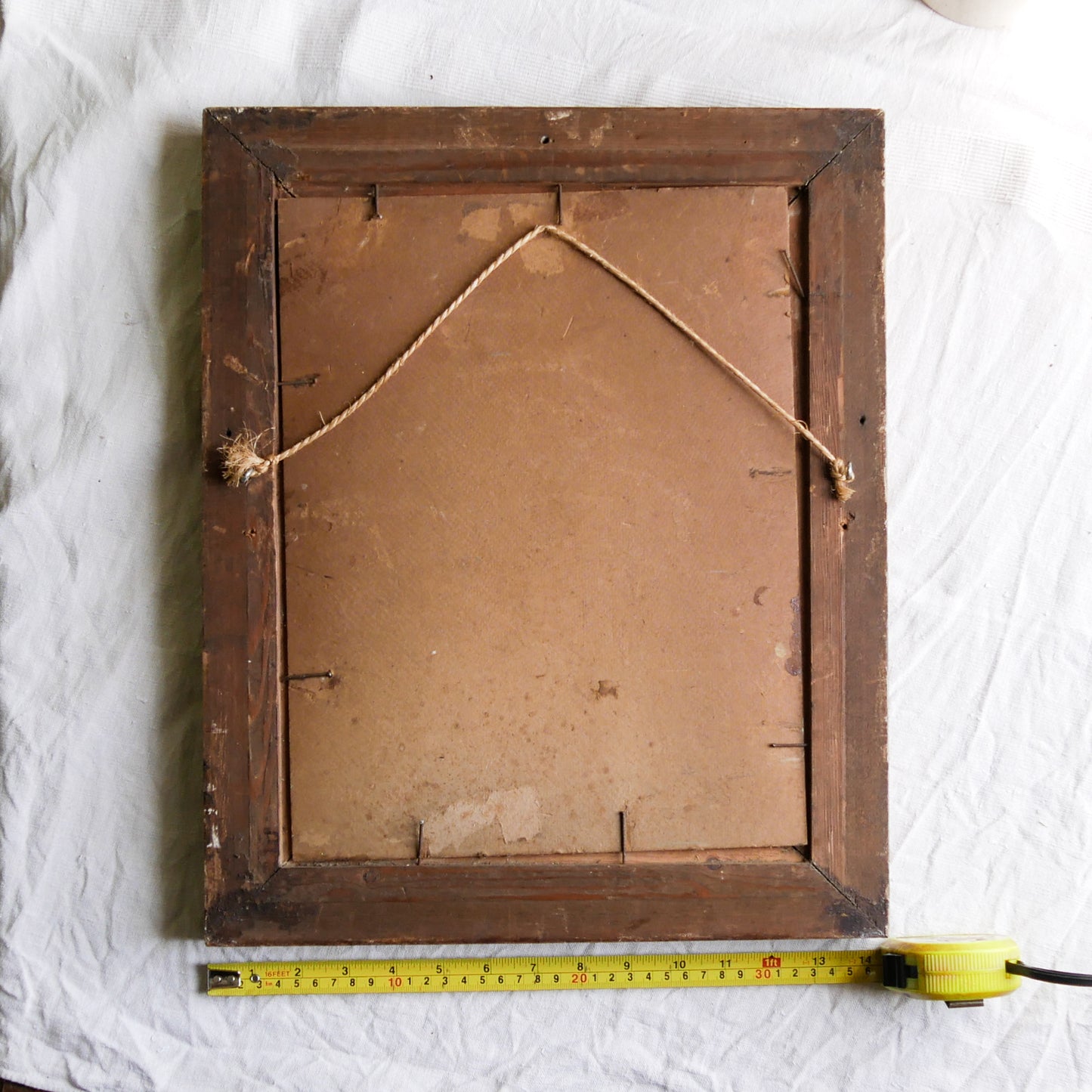 An original vintage landscape oil painting depicting a charming country home in among a wooded area with hills in the background. In the foreground a gentle river reflects the trees in the background.
The painting has been painted by an experienced artist with confident brush strokes - a really wonderful piece of original art.
The painting is presented in an old worn wooden frame which we love and think others will too - it really suits this piece.