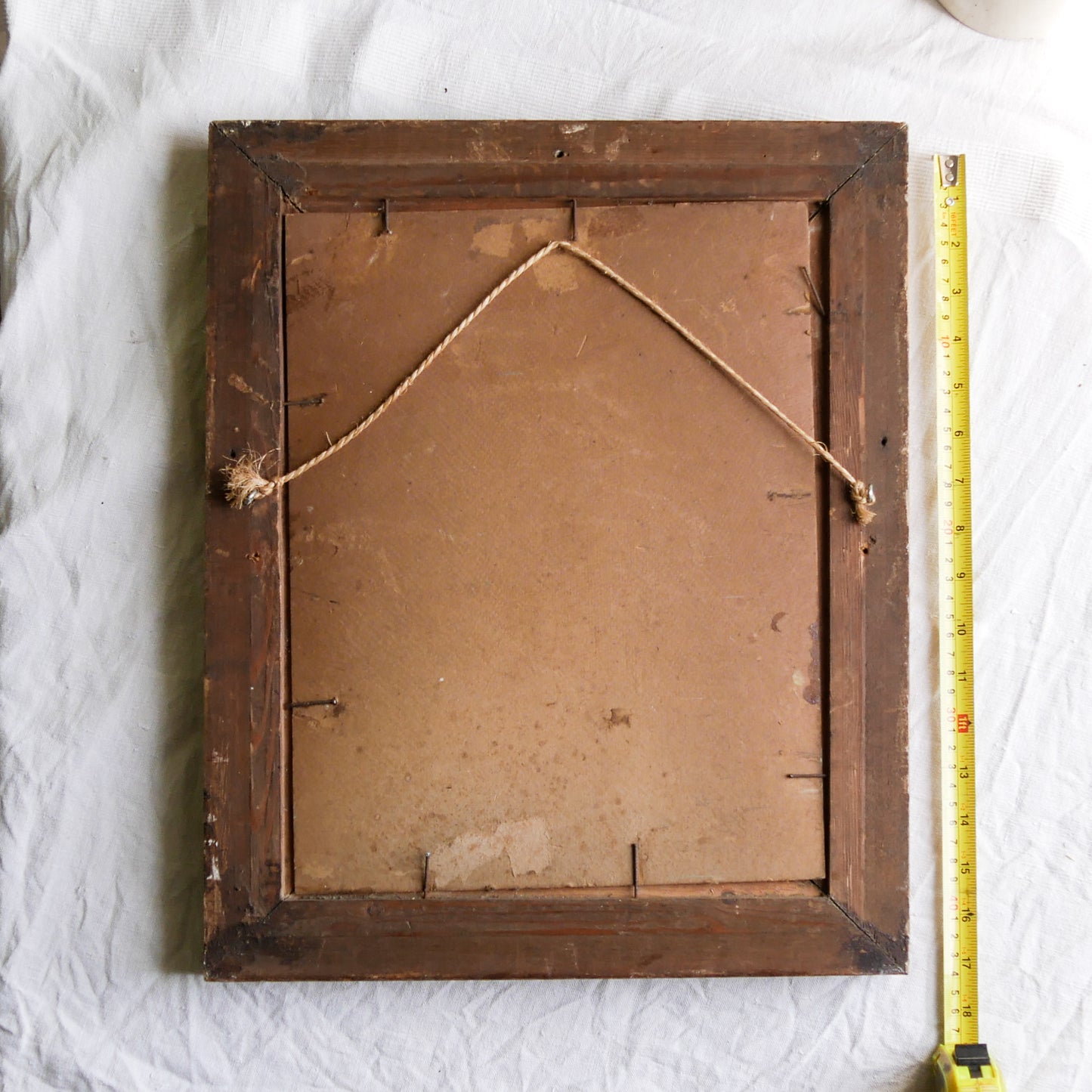 An original vintage landscape oil painting depicting a charming country home in among a wooded area with hills in the background. In the foreground a gentle river reflects the trees in the background.
The painting has been painted by an experienced artist with confident brush strokes - a really wonderful piece of original art.
The painting is presented in an old worn wooden frame which we love and think others will too - it really suits this piece.