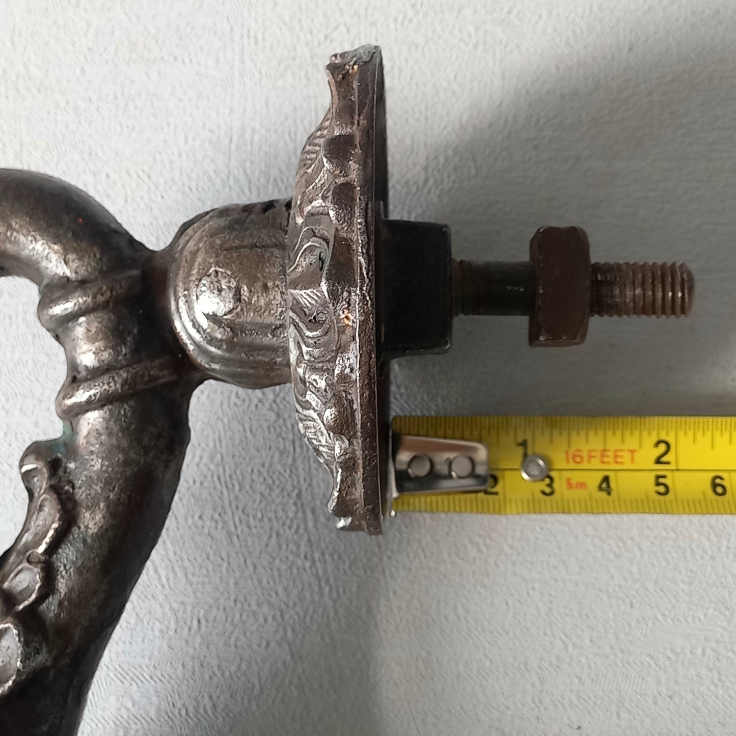 A stunning and large antique cast iron decorative door knocker with an elegant swan's neck and head, a very heavy and original antique piece purchased in south west France.