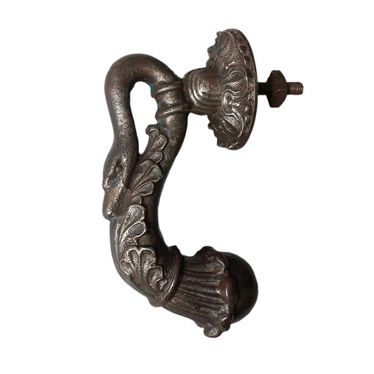 A stunning and large antique cast iron decorative door knocker with an elegant swan's neck and head, a very heavy and original antique piece purchased in south west France.