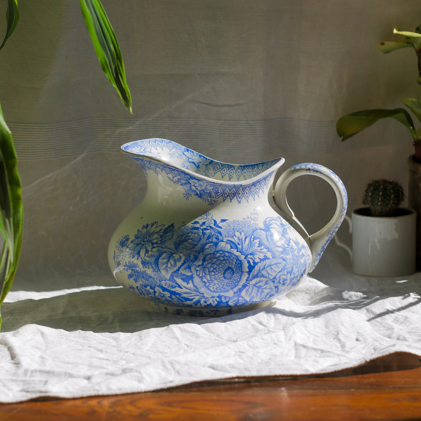 A beautiful French antique white ironstone jug with a pretty floral blue pattern. Once used as wash jugs these days these lovely old jugs make super pieces of home decor. The maker's mark is clearly identified underneath. A wonderful piece of antique ironstone!
Circa: late 1800s/early 1900s.