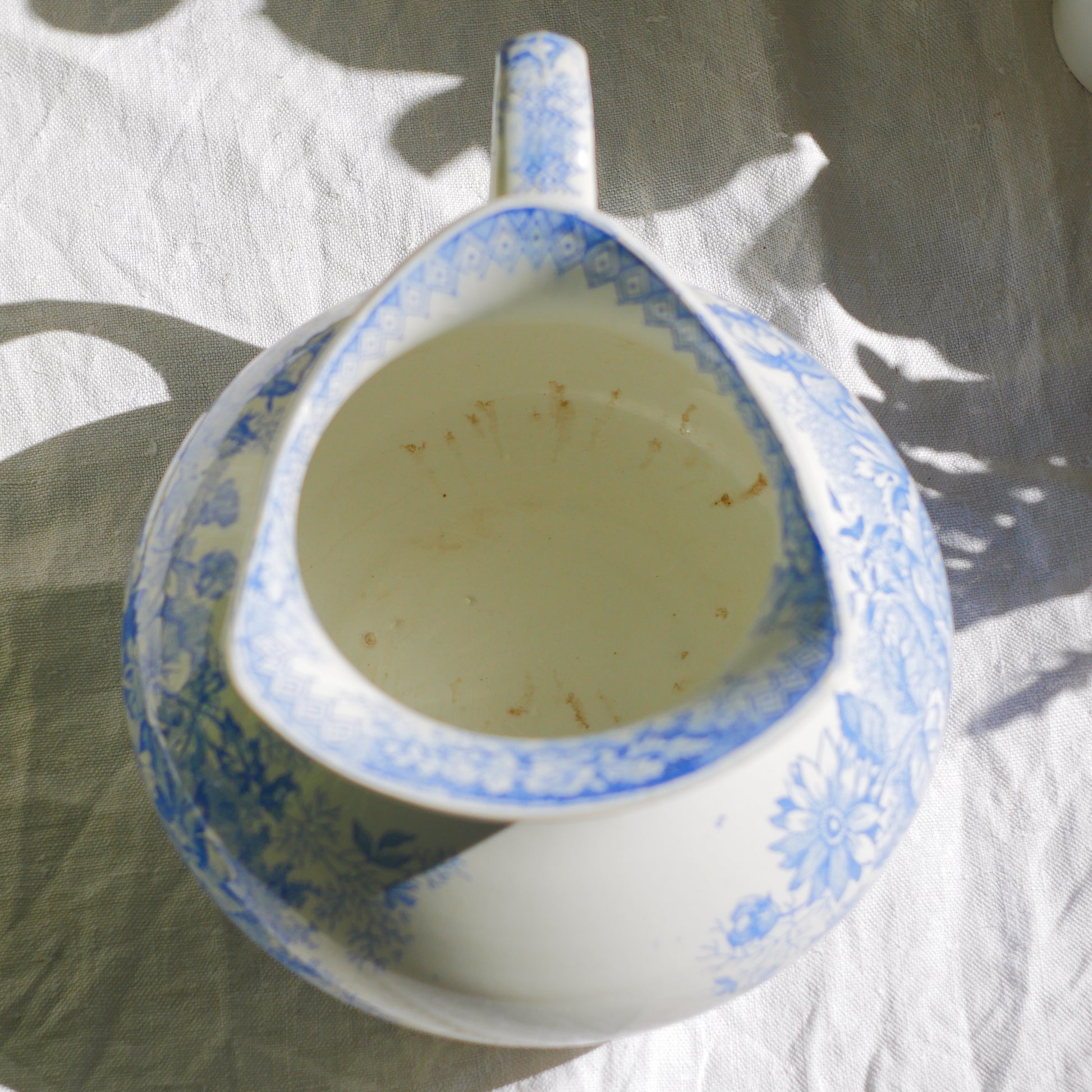 A beautiful French antique white ironstone jug with a pretty floral blue pattern. Once used as wash jugs these days these lovely old jugs make super pieces of home decor. The maker's mark is clearly identified underneath. A wonderful piece of antique ironstone!
Circa: late 1800s/early 1900s.