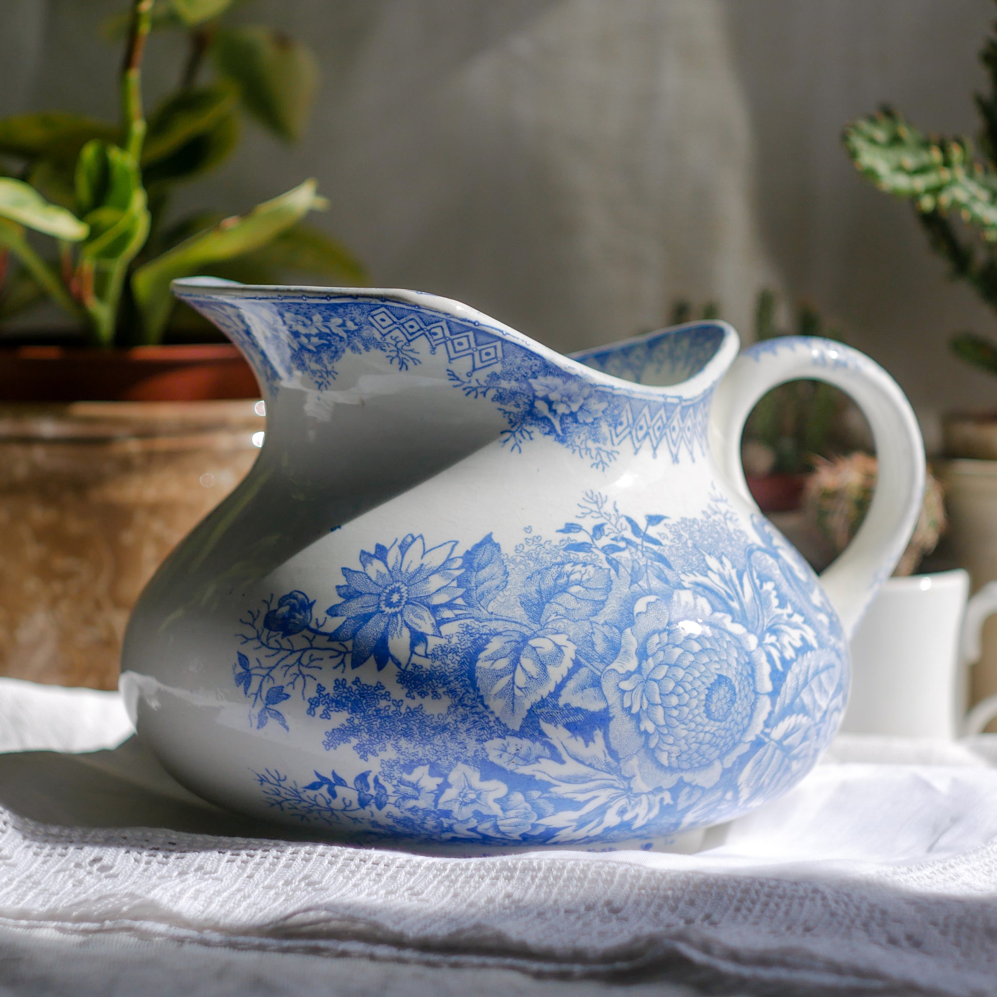 A beautiful French antique white ironstone jug with a pretty floral blue pattern. Once used as wash jugs these days these lovely old jugs make super pieces of home decor. The maker's mark is clearly identified underneath. A wonderful piece of antique ironstone!
Circa: late 1800s/early 1900s.