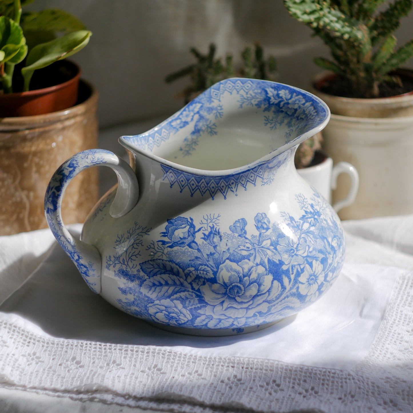 A beautiful French antique white ironstone jug with a pretty floral blue pattern. Once used as wash jugs these days these lovely old jugs make super pieces of home decor. The maker's mark is clearly identified underneath. A wonderful piece of antique ironstone!
Circa: late 1800s/early 1900s.