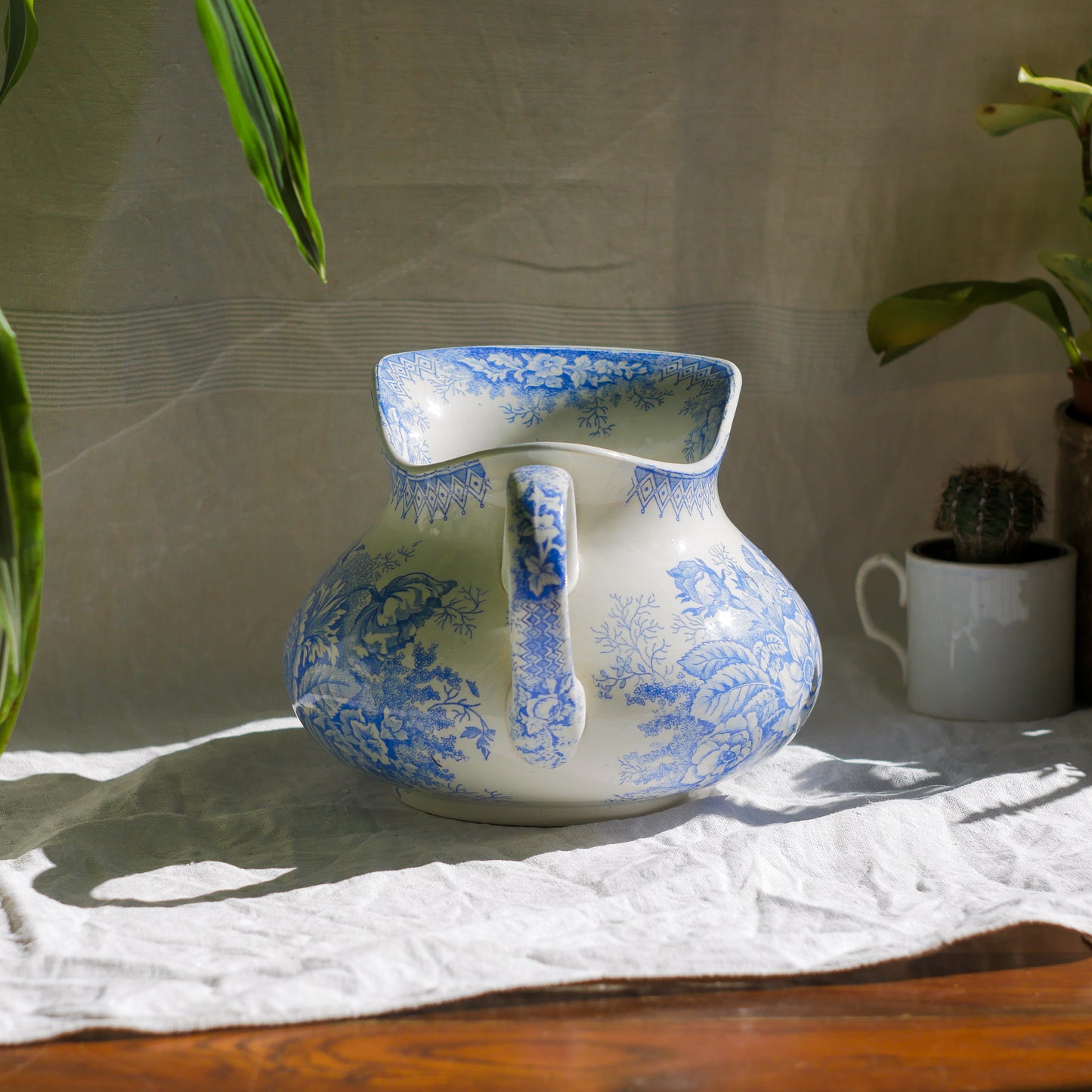 A beautiful French antique white ironstone jug with a pretty floral blue pattern. Once used as wash jugs these days these lovely old jugs make super pieces of home decor. The maker's mark is clearly identified underneath. A wonderful piece of antique ironstone!
Circa: late 1800s/early 1900s.