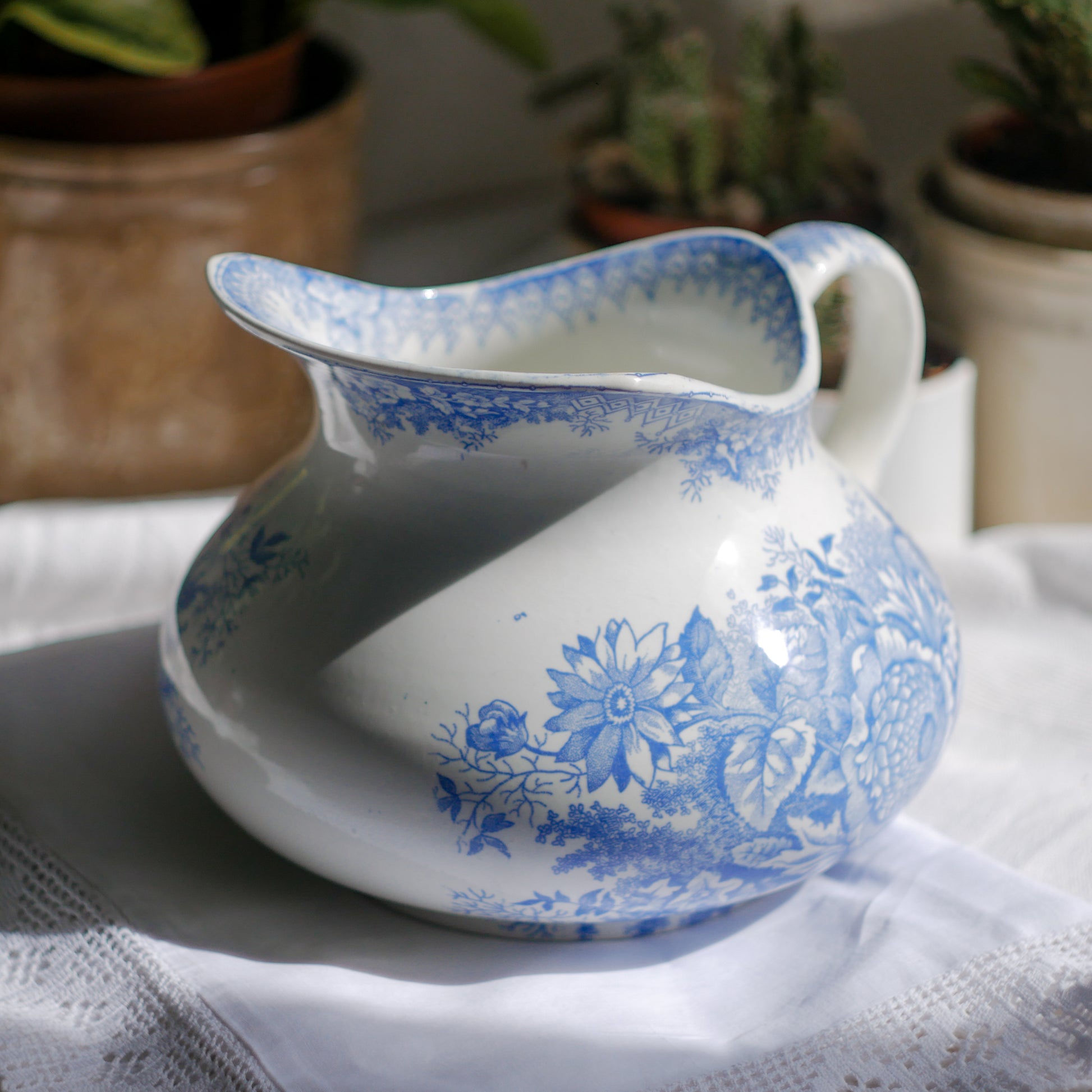 A beautiful French antique white ironstone jug with a pretty floral blue pattern. Once used as wash jugs these days these lovely old jugs make super pieces of home decor. The maker's mark is clearly identified underneath. A wonderful piece of antique ironstone!
Circa: late 1800s/early 1900s.