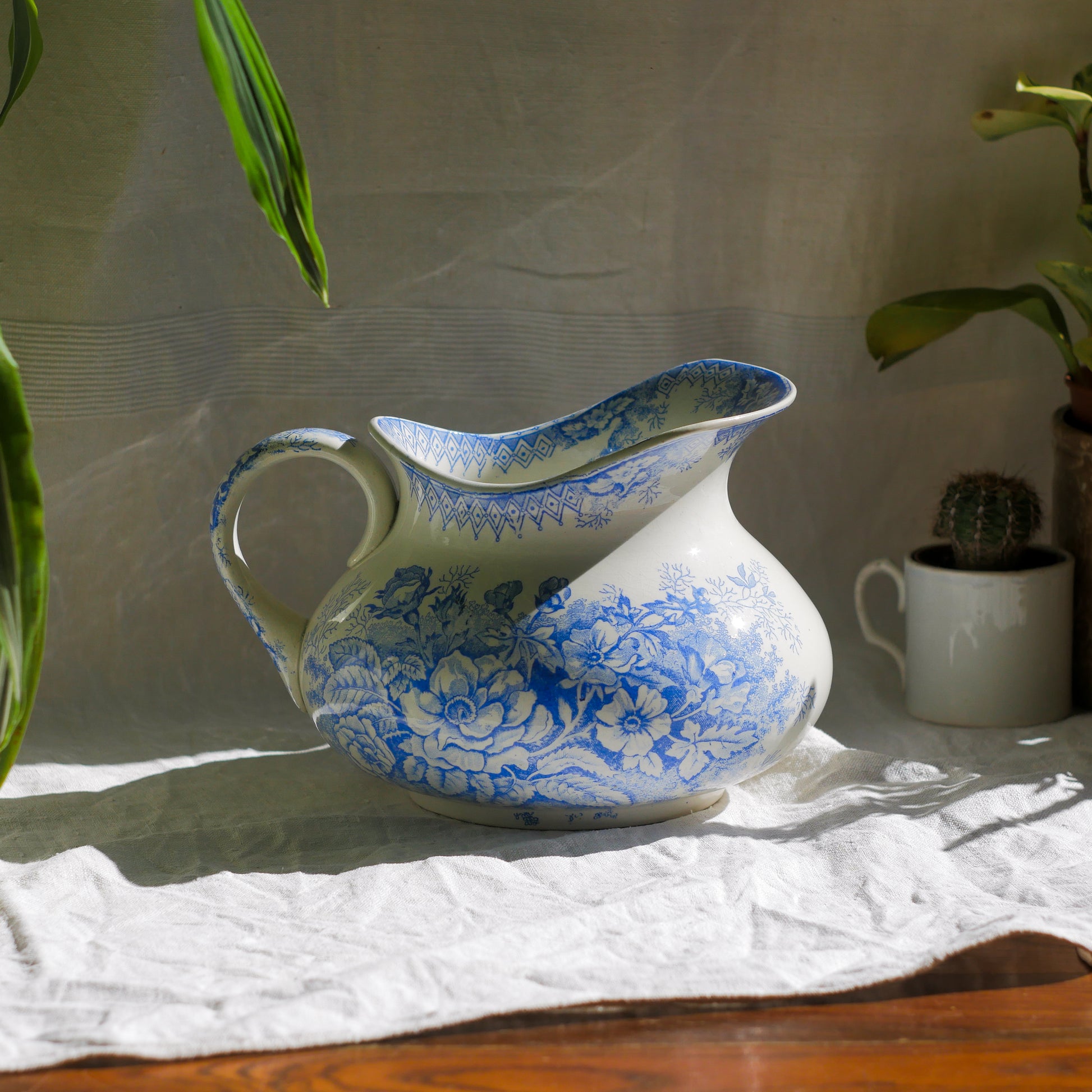A beautiful French antique white ironstone jug with a pretty floral blue pattern. Once used as wash jugs these days these lovely old jugs make super pieces of home decor. The maker's mark is clearly identified underneath. A wonderful piece of antique ironstone!
Circa: late 1800s/early 1900s.