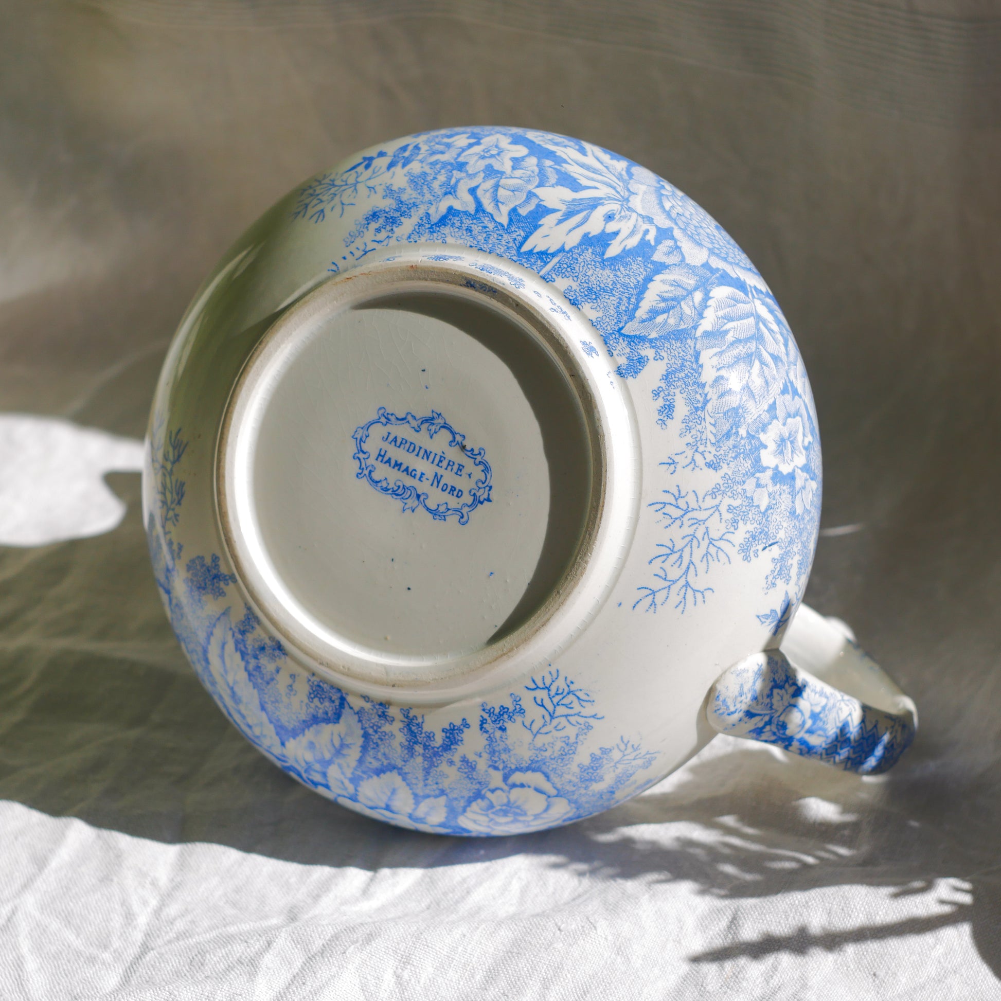 A beautiful French antique white ironstone jug with a pretty floral blue pattern. Once used as wash jugs these days these lovely old jugs make super pieces of home decor. The maker's mark is clearly identified underneath. A wonderful piece of antique ironstone!
Circa: late 1800s/early 1900s.
