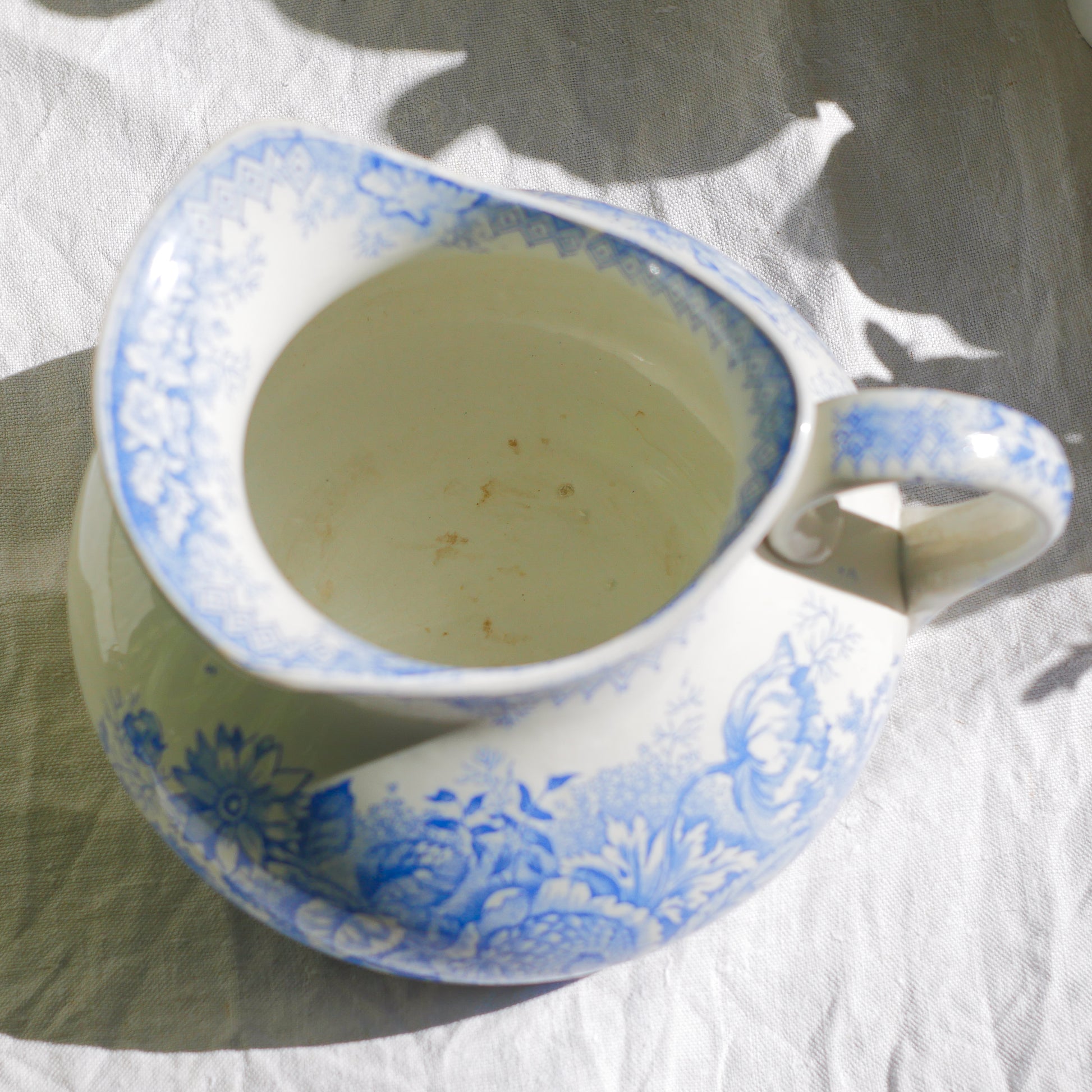 A beautiful French antique white ironstone jug with a pretty floral blue pattern. Once used as wash jugs these days these lovely old jugs make super pieces of home decor. The maker's mark is clearly identified underneath. A wonderful piece of antique ironstone!
Circa: late 1800s/early 1900s.