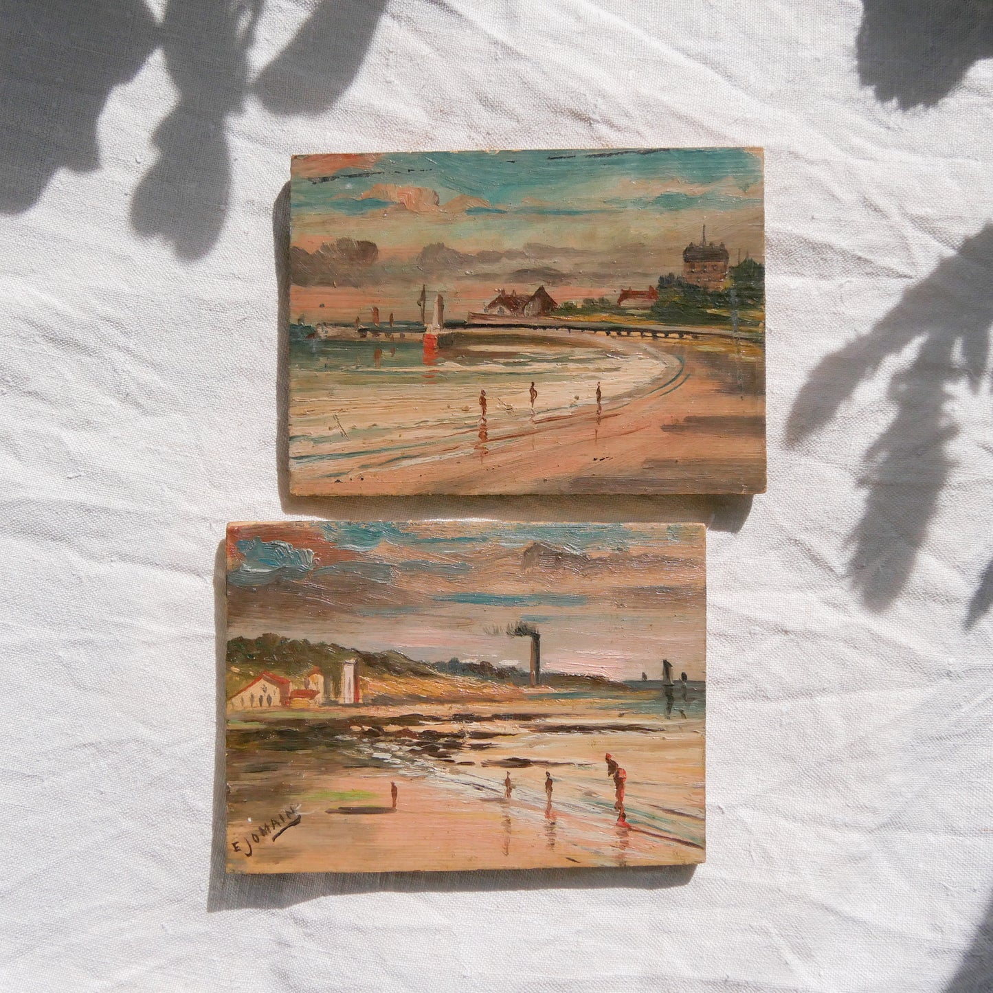 A beautiful pair of small coastal beach paintings on little wooden boards. Each original painting is wonderfully rendered with delightful and moody colours. The artist has signed one painting.
These original pieces of art look great displayed against a wall or on a mantelpiece, etc, and would also look equally nice on miniature easels as seen in two of our photos, or framed and on the wall - many possibilities!