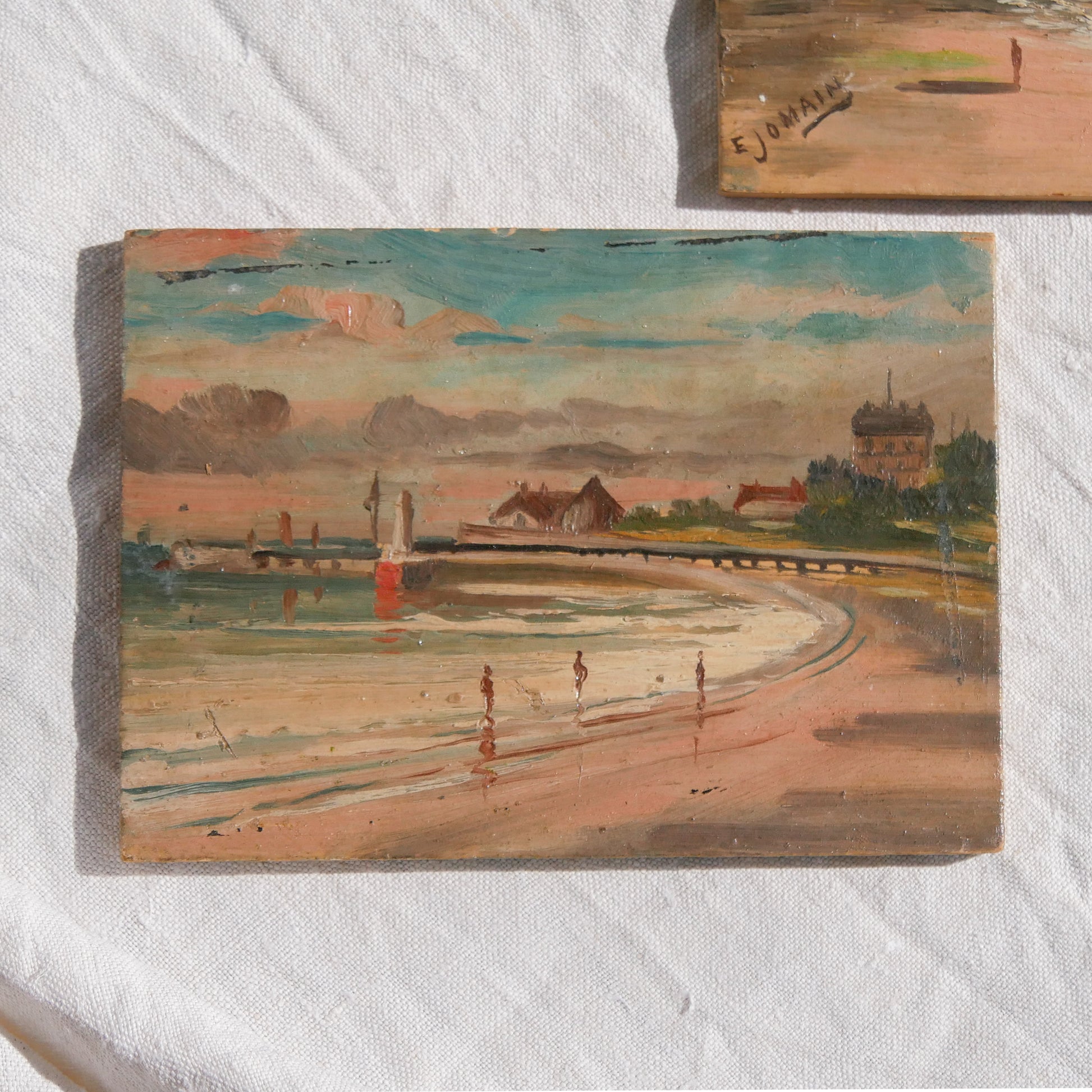 A beautiful pair of small coastal beach paintings on little wooden boards. Each original painting is wonderfully rendered with delightful and moody colours. The artist has signed one painting.
These original pieces of art look great displayed against a wall or on a mantelpiece, etc, and would also look equally nice on miniature easels as seen in two of our photos, or framed and on the wall - many possibilities!