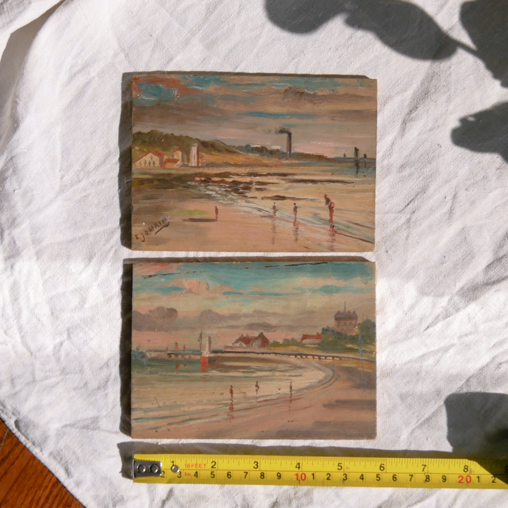 A beautiful pair of small coastal beach paintings on little wooden boards. Each original painting is wonderfully rendered with delightful and moody colours. The artist has signed one painting.
These original pieces of art look great displayed against a wall or on a mantelpiece, etc, and would also look equally nice on miniature easels as seen in two of our photos, or framed and on the wall - many possibilities!