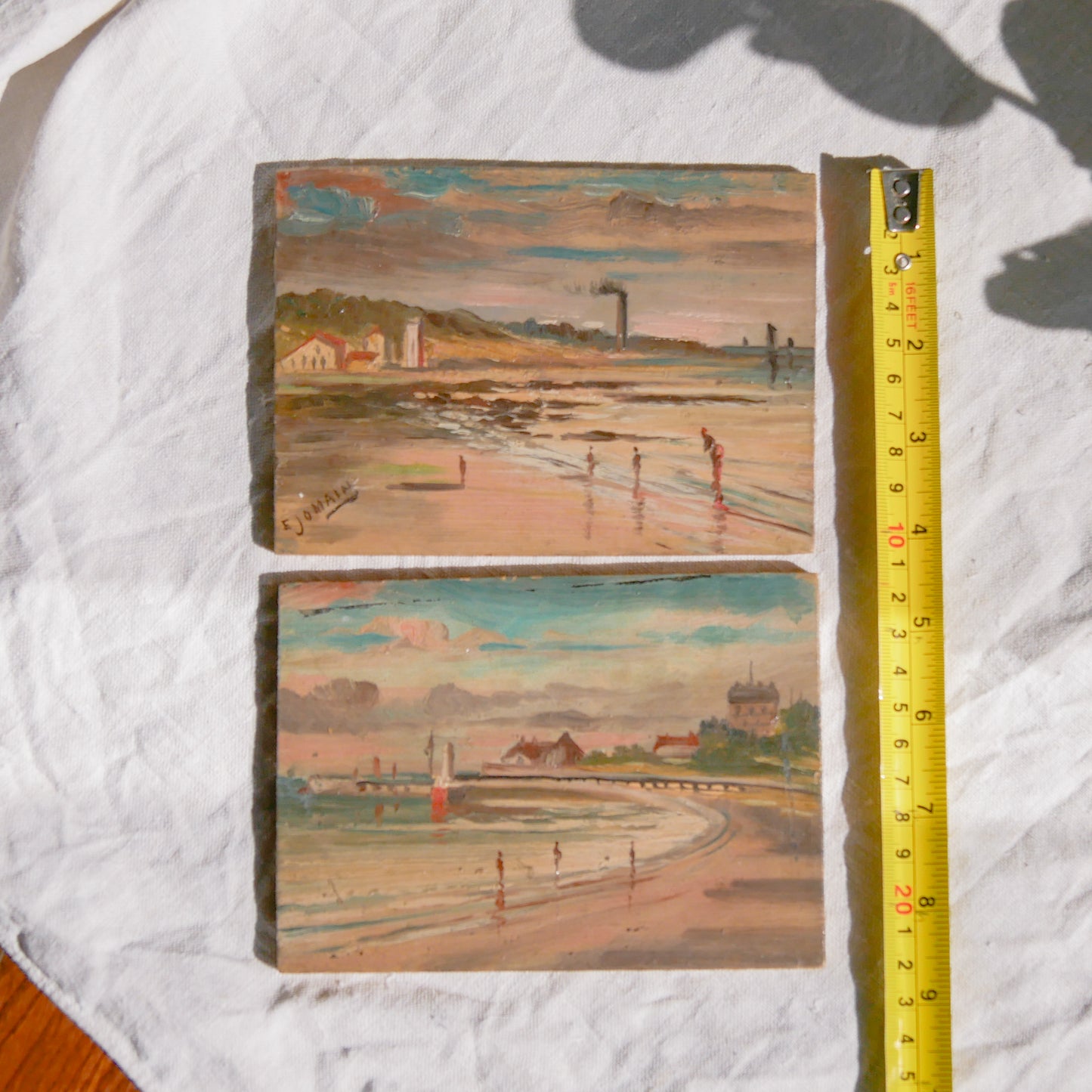 A beautiful pair of small coastal beach paintings on little wooden boards. Each original painting is wonderfully rendered with delightful and moody colours. The artist has signed one painting.
These original pieces of art look great displayed against a wall or on a mantelpiece, etc, and would also look equally nice on miniature easels as seen in two of our photos, or framed and on the wall - many possibilities!