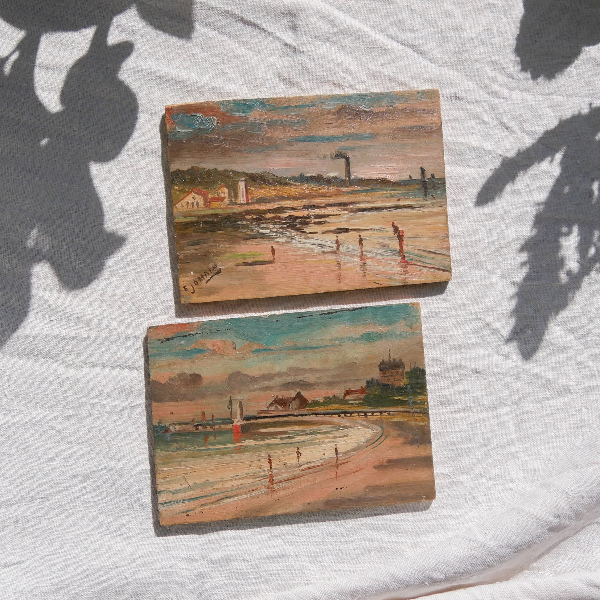 A beautiful pair of small coastal beach paintings on little wooden boards. Each original painting is wonderfully rendered with delightful and moody colours. The artist has signed one painting.
These original pieces of art look great displayed against a wall or on a mantelpiece, etc, and would also look equally nice on miniature easels as seen in two of our photos, or framed and on the wall - many possibilities!