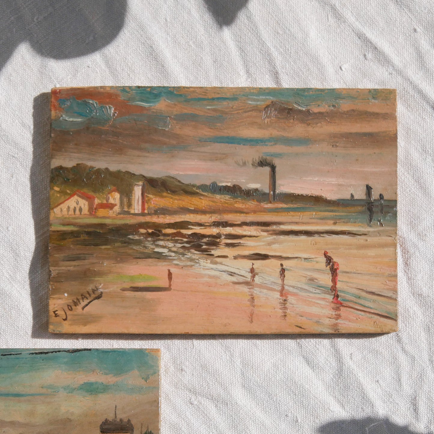 A beautiful pair of small coastal beach paintings on little wooden boards. Each original painting is wonderfully rendered with delightful and moody colours. The artist has signed one painting.
These original pieces of art look great displayed against a wall or on a mantelpiece, etc, and would also look equally nice on miniature easels as seen in two of our photos, or framed and on the wall - many possibilities!
