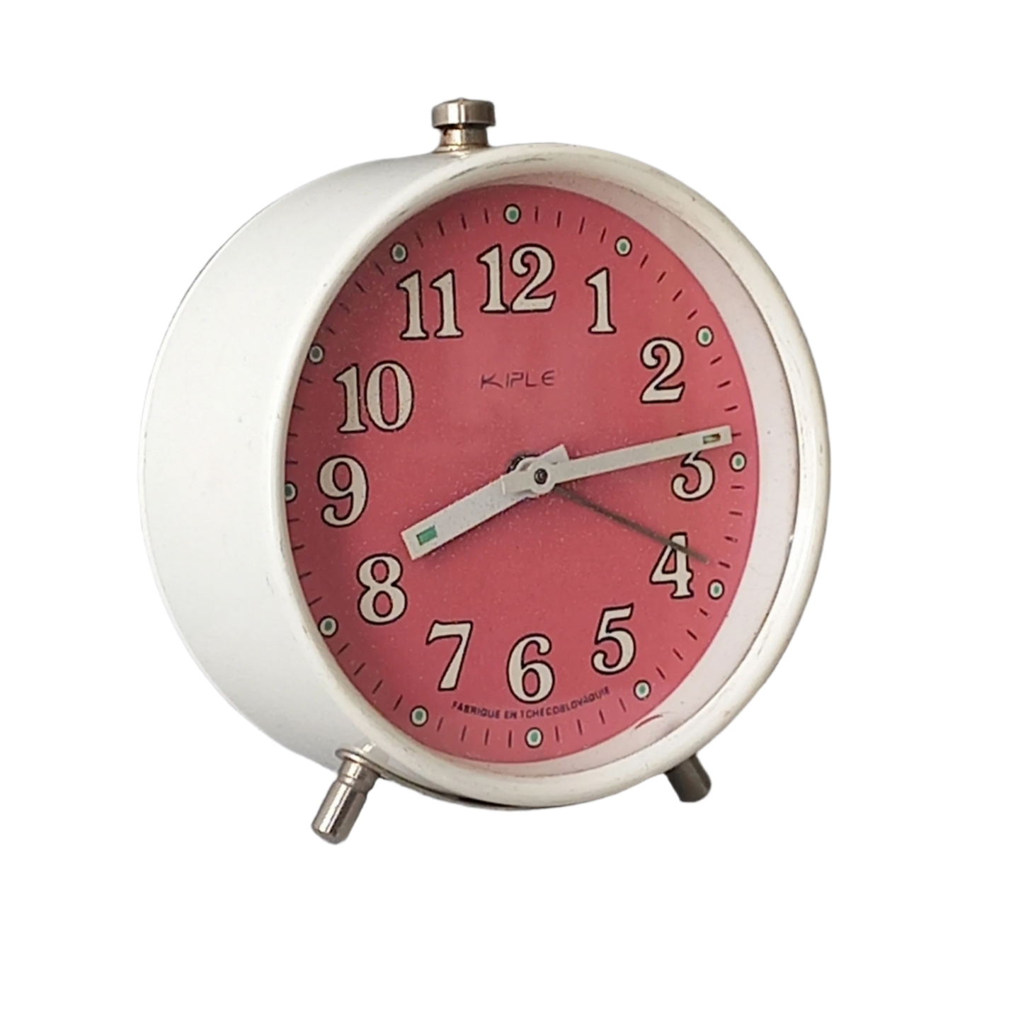 A vintage alarm clock in an eye-catching white and pink color scheme. This old clock is in working condition including the alarm and has a nice soothing ticking sound too. A great piece of European history from the former country of Czechoslovakia.
In summary, a nice vintage alarm clock!