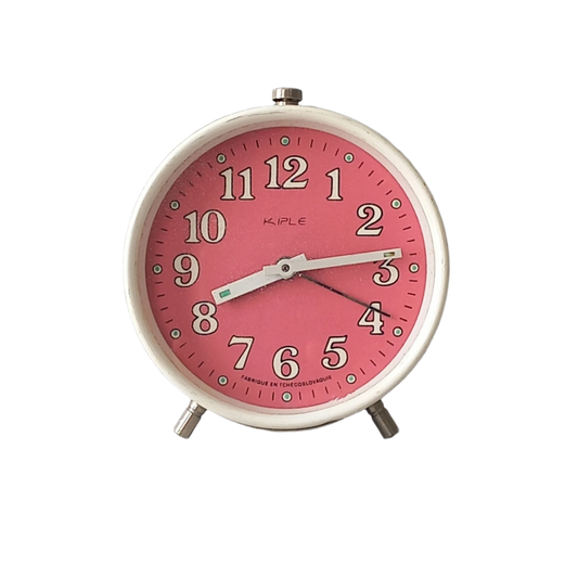 A vintage alarm clock in an eye-catching white and pink color scheme. This old clock is in working condition including the alarm and has a nice soothing ticking sound too. A great piece of European history from the former country of Czechoslovakia.
In summary, a nice vintage alarm clock!