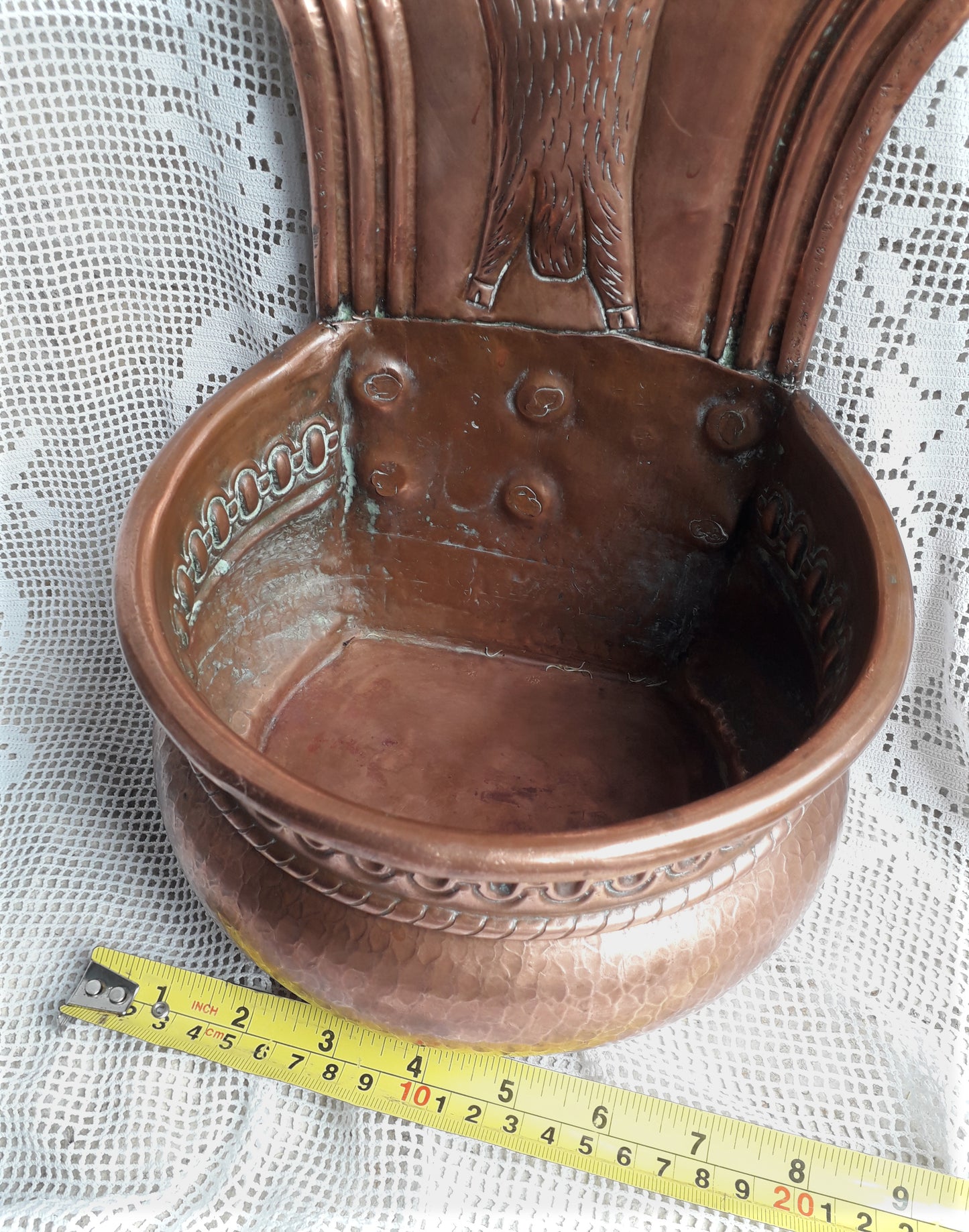 A very handsome copper vintage/antique wall-mounted planter with a hunting scene that I purchased in south west France.
This wonderful rustic piece may at some time have had another purpose, although being a planter seems to suit it just perfectly. There is a hanging hook to the rear, although it can also be displayed sitting on a flat surface as it's depicted in my photos - it's very interesting that we can also see the crude yet charming way this heavy copper planter was constructed by the artisan.