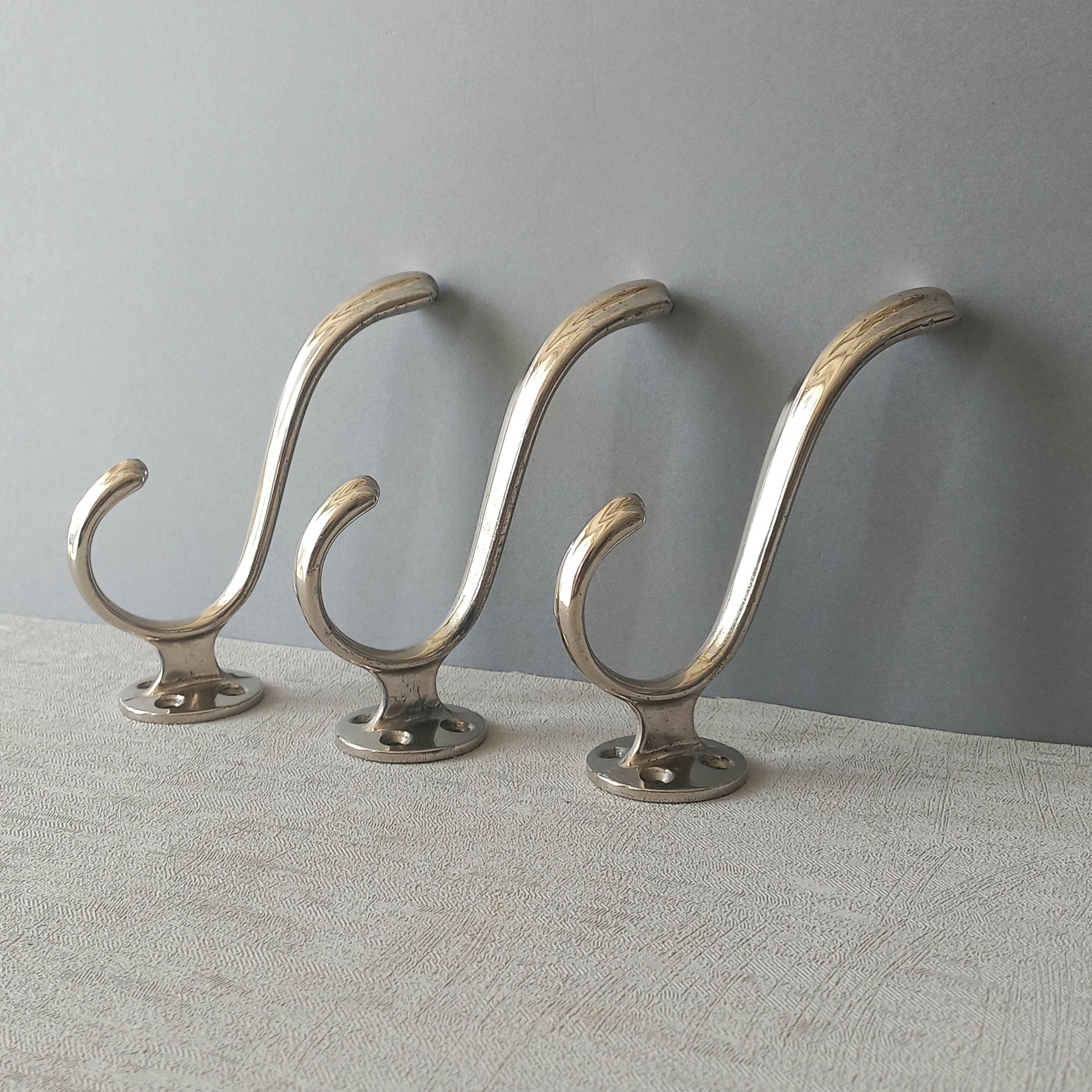 3 x French vintage silver coloured metal coat hooks in used sturdy used condition. Good for coat storage, dog leads, or maybe in the kitchen or bathroom for towels.
Circa. 1930s/1950s.
